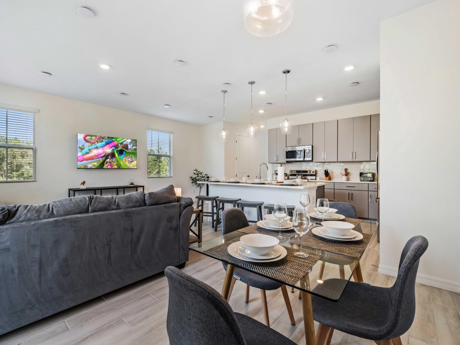 A beautiful townhouse with an open layout that creates a sense of spaciousness - Thoughtfully designed for both relaxation and entertainment, with comfy seating and elegant decor - Kitchen equipped with an island, serves as a perfect gathering spot