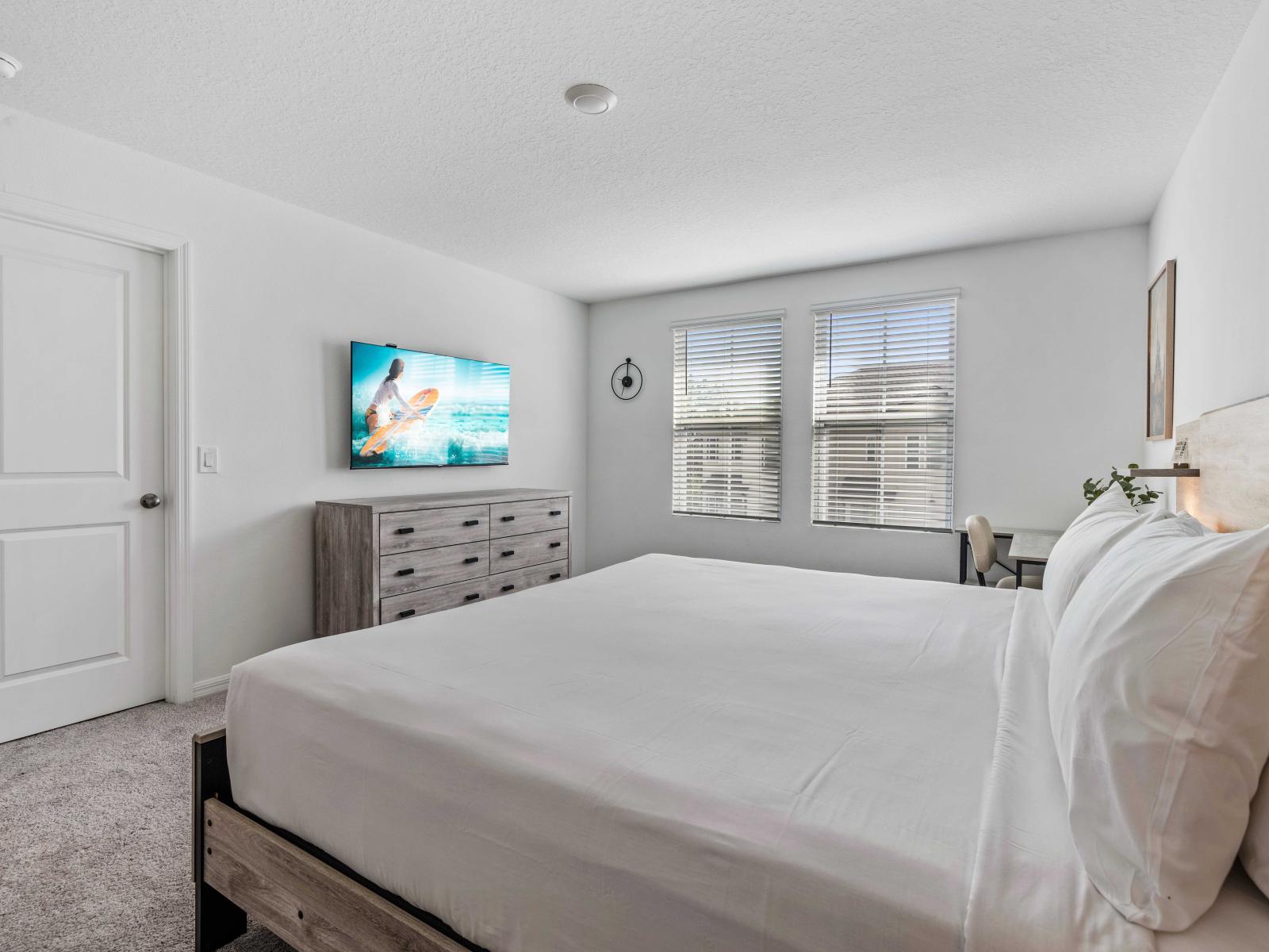 Enjoy sweet dreams in the plush and inviting bedroom, designed for your comfort - Featuring a comfortable king-size bed with crisp white linens - Smart TV for your entertainment, plenty of natural light through large windows