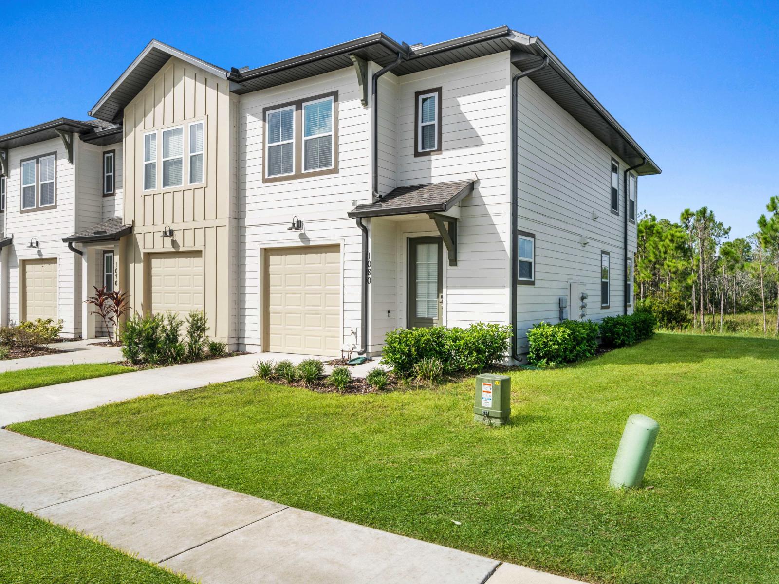 Attractive exterior boasts a well-kept lawn and appealing architectural design - This location is ideal for families seeking a tranquil yet convenient living space - Elegantly blending tradition and modernity in its design