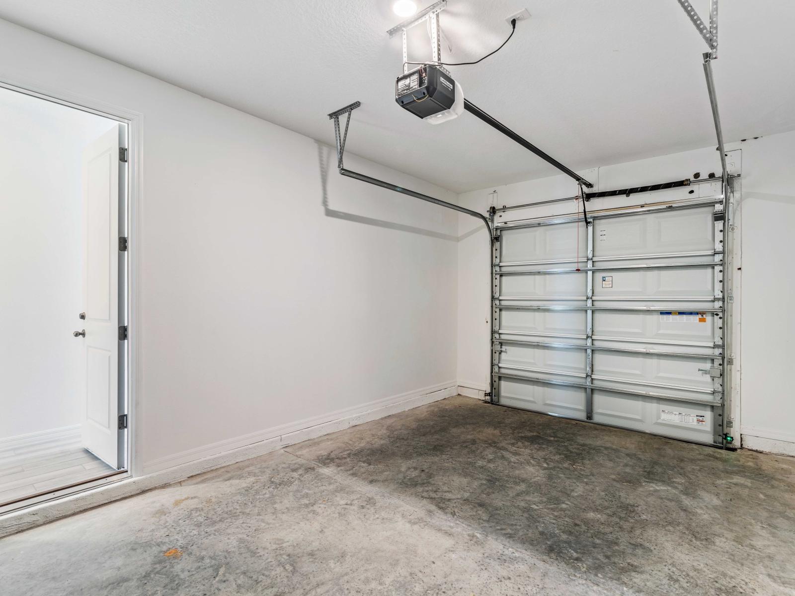 The spacious and clean garage provides plenty of room for a vehicle and additional storage - Automatic garage door opener adds convenience, allowing for easy entry and exit - Access from the garage to the interior of the home enhances convenience