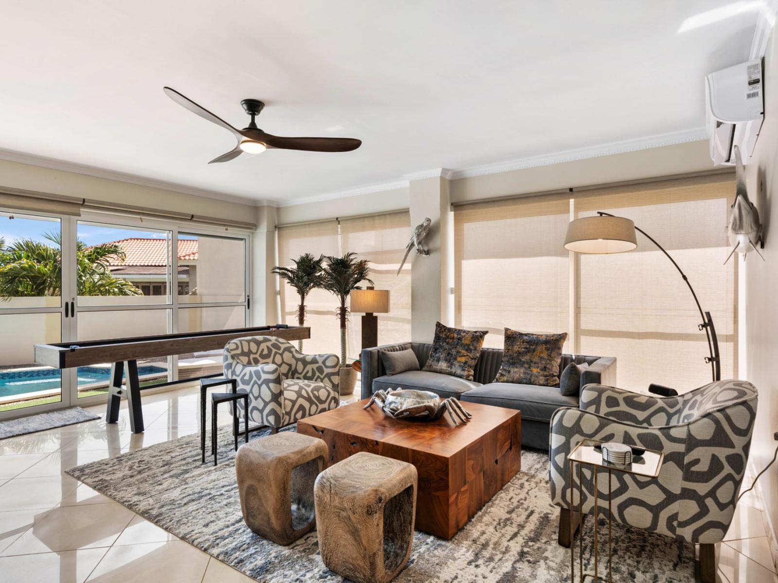 - Bright and inviting living room with a glass sliding door that opens directly to the backyard - Comfortable seating and stylish decor make it the perfect spot to relax - Seamless indoor-outdoor flow, ideal for entertaining or enjoying the view