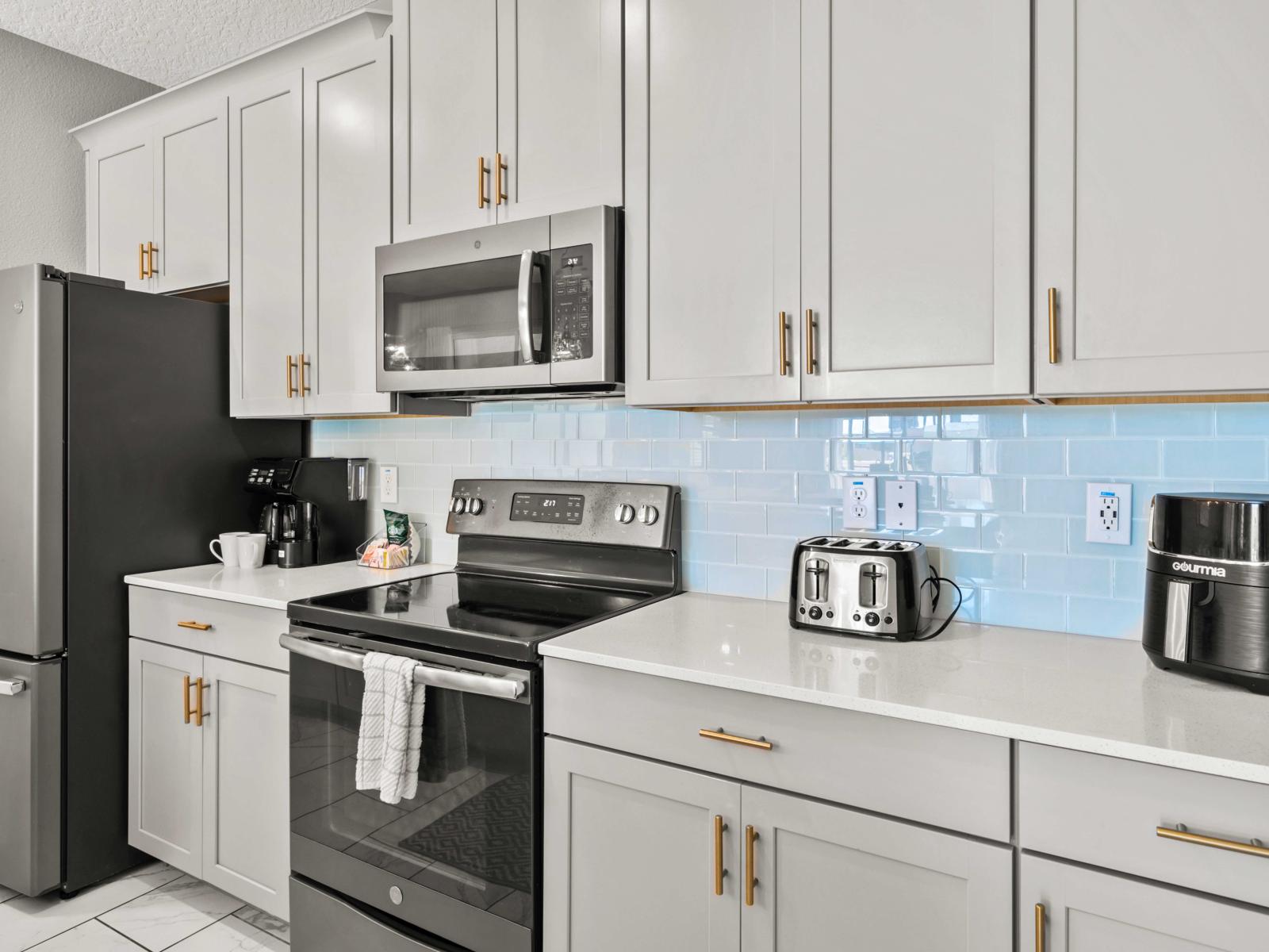 - Sleek and modern kitchen equipped with top-of-the-line appliances and stylish cabinetry - Prepare meals with ease in this bright, functional, and beautifully designed space - The perfect blend of elegance and practicality for culinary creativity