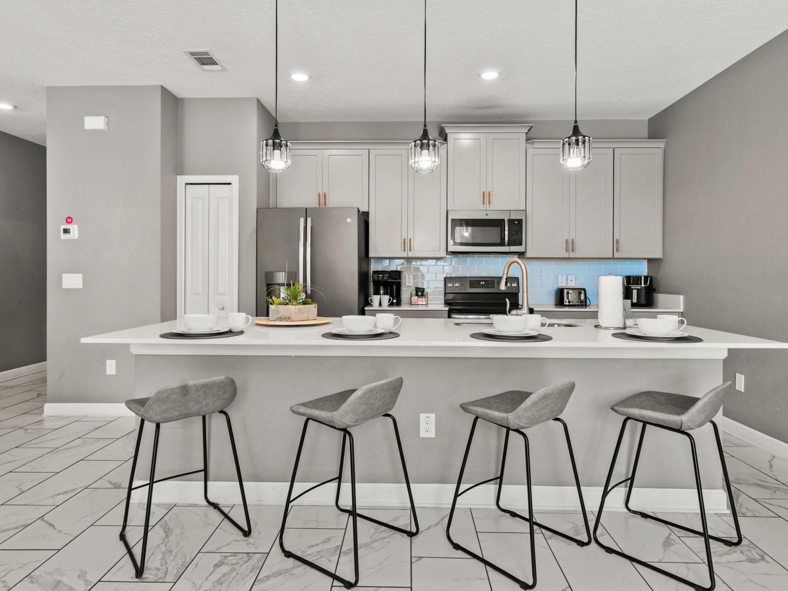 - Gather around this stylish kitchen island with bar stools for four, perfect for casual meals - The modern design, and elegant lighting make it an inviting space for everyone - Enjoy a blend of comfort in this beautifully designed kitchen hub