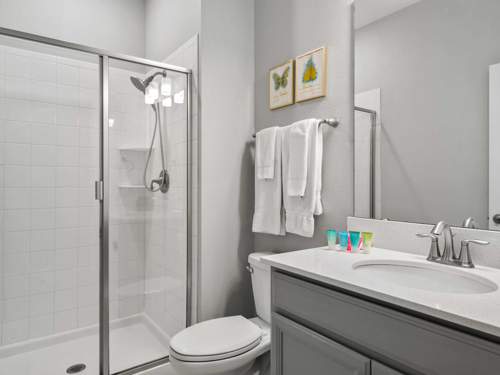 - Refresh and rejuvenate in this modern bathroom featuring a sleek glass-enclosed shower - Bright, clean, and thoughtfully designed with all the essentials for a comfortable stay - A serene space designed to provide both relaxation and convenience