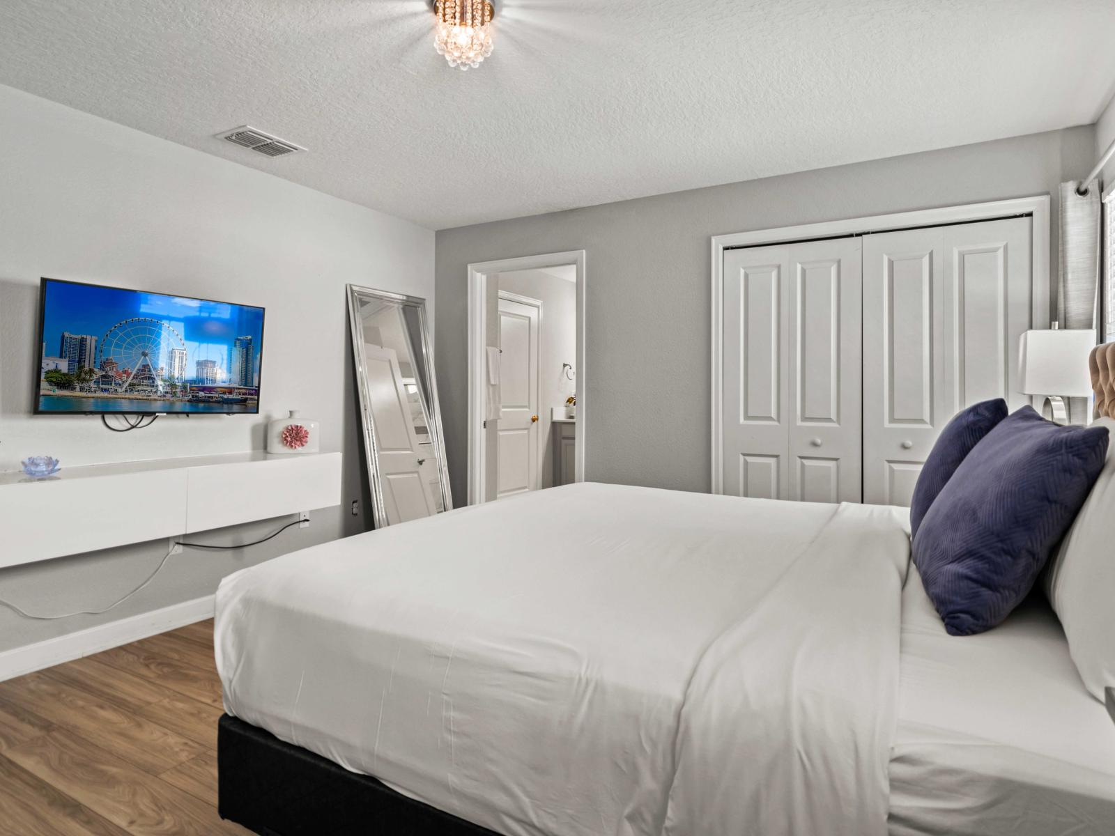 - Spacious main bedroom with a plush king-size bed, private en-suite bathroom, and wall-mounted TV - Bright, modern decor with ample storage and natural light for a comfortable stay - Your perfect retreat, combining style, relaxation, and convenience