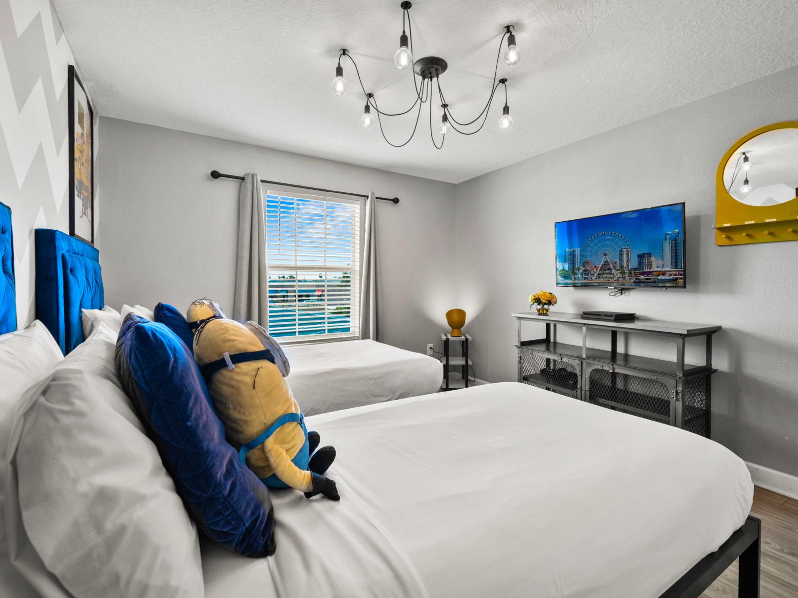 - Bedroom offers a playful ambiance with Minions-themed decor and two cozy single beds - Perfect for kids or young-at-heart guests, this space is both fun and comfortable - Enjoy entertainment on the wall-mounted TV in this creatively designed room