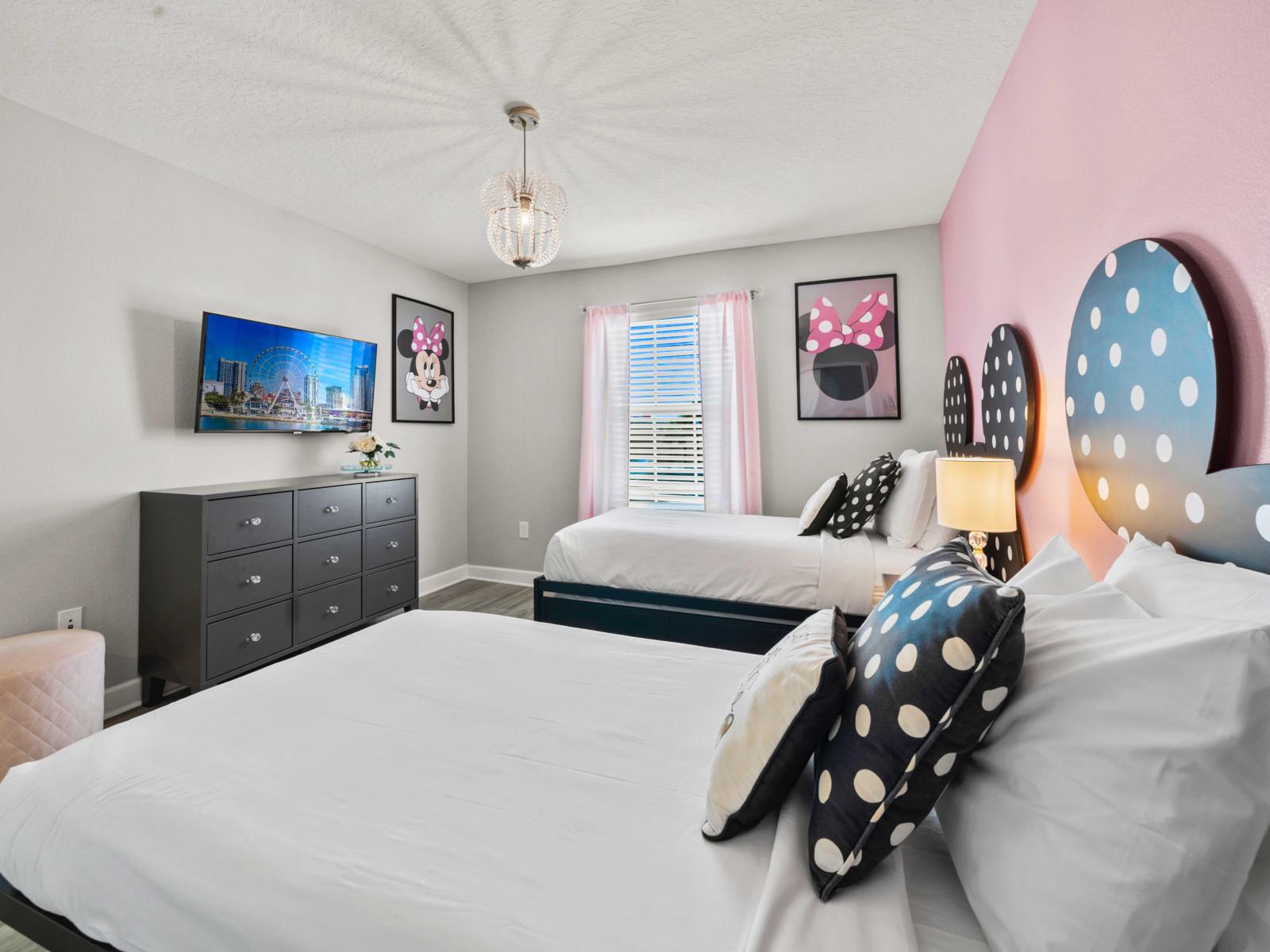 - Bedroom features Disney-themed decor with two cozy single beds, ideal for kids or Disney lovers - Bright and playful, with Minnie Mouse-inspired headboards and charming details - A comfortable and imaginative space, complete with a wall-mounted TV