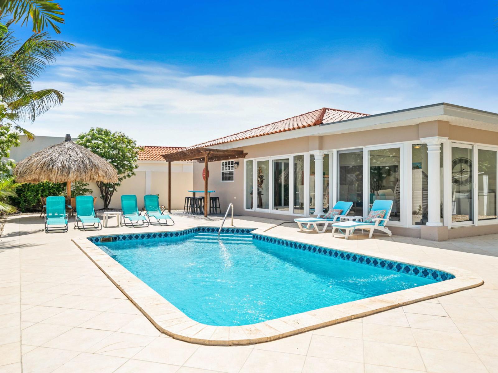 Dive into luxury with your own private pool, perfect for unwinding after a day of adventure - Experience ultimate relaxation in serene backyard oasis, featuring plenty of lounge chairs - Cool off and soak up the sun in exclusive private pool