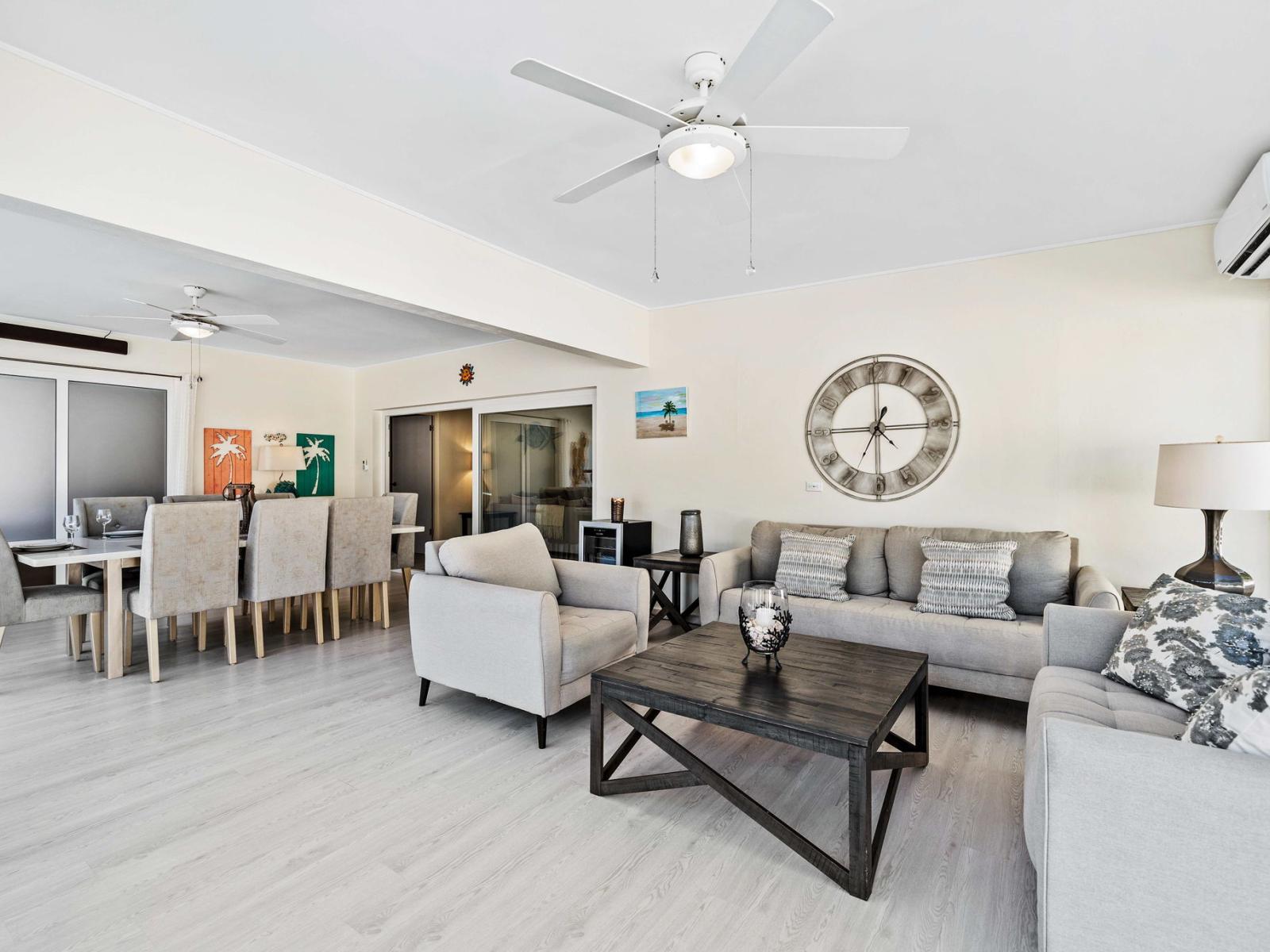 Experience the essence of cozy living in well-appointed living and dining area - Chic and contemporary design with clean lines and modern furnishings like plush seating - Open-concept living area seamlessly connected to a stylish dining space