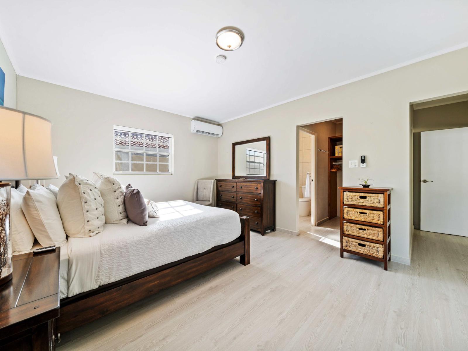 Enjoy a restful sleep in a spacious bedroom designed for ultimate comfort and relaxation - Unwind in a beautifully furnished bedroom with soft linens and plush queen size bed - Spacious bedroom offering comfort and style