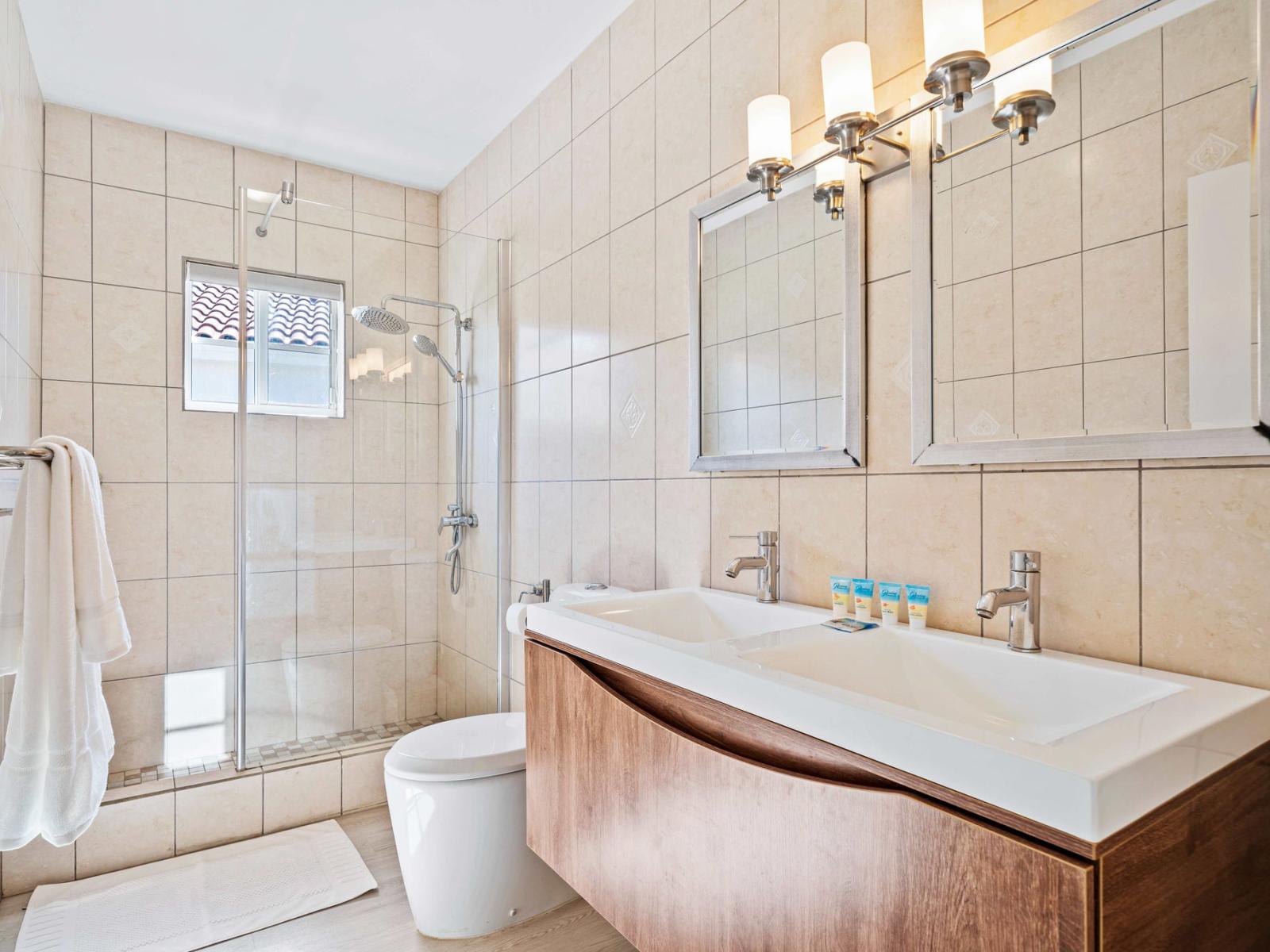 Escape to serenity in the beautifully crafted and immaculately clean bathroom - Contemporary fixtures provide an indulgent touch to the design - An elegant bathroom adorned with quality fixtures, spacious walk-in shower and dual vanity