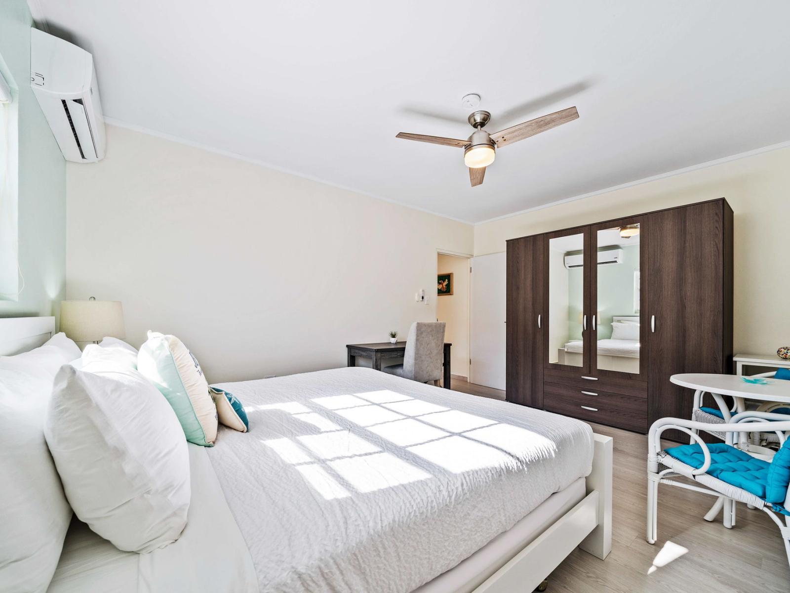 Wake up refreshed in a tranquil bedroom with plenty of natural light and soothing colors - The bedroom provides a perfect escape with its inviting ambiance and stylish furnishings - King size bed for restful night sleeps and additional seating