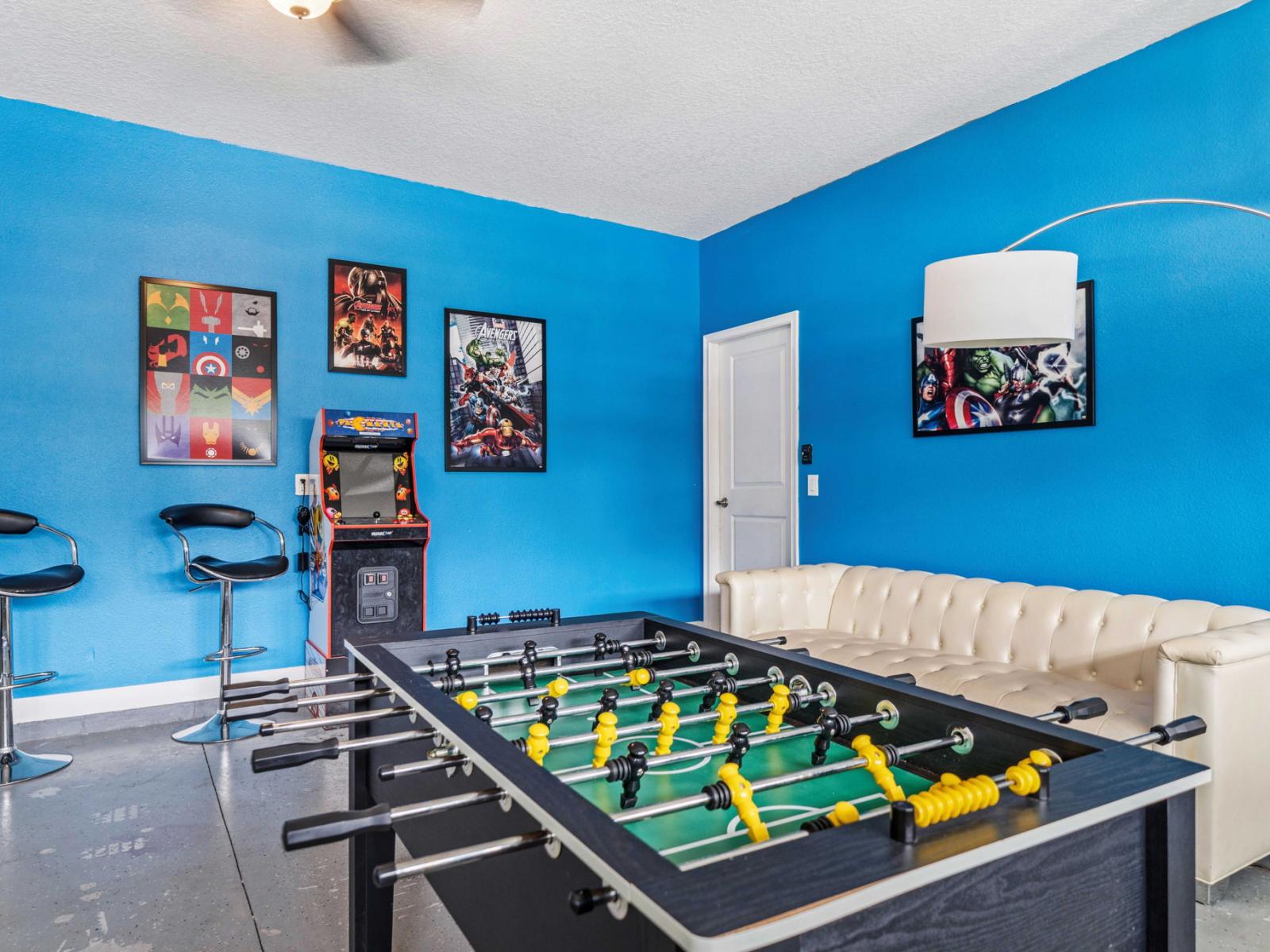 - Game room is a fun and lively space designed for entertainment and relaxation - Featuring a foosball table and an arcade machine for hours of enjoyment - Comfortable seating  making it a favorite spot for kids and adults alike