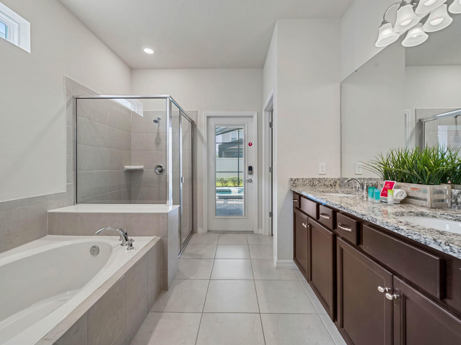 Bathroom 1 with a bathtub and a walk-in shower