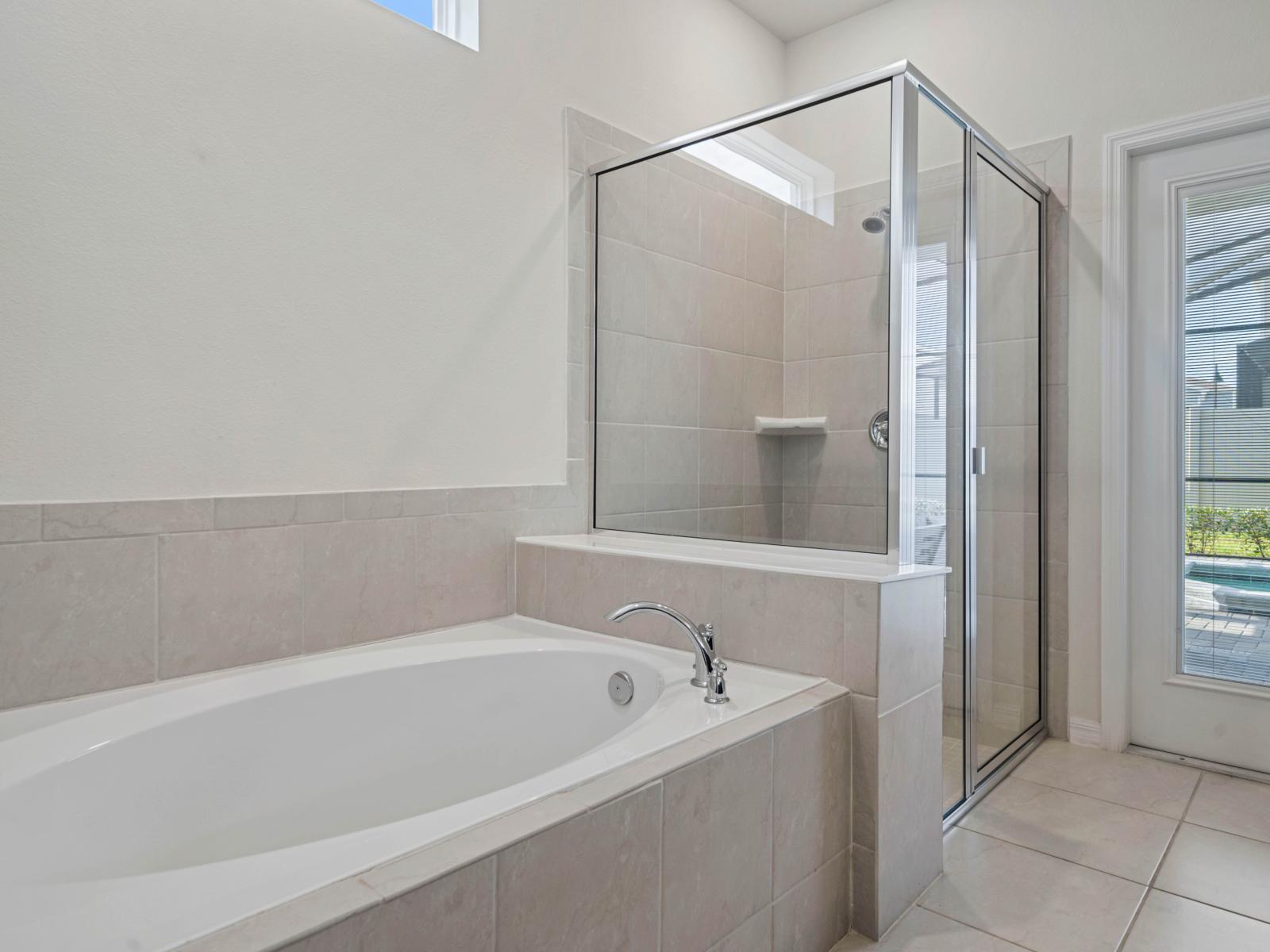 Bathroom 1 with a bathtub and a walk-in shower