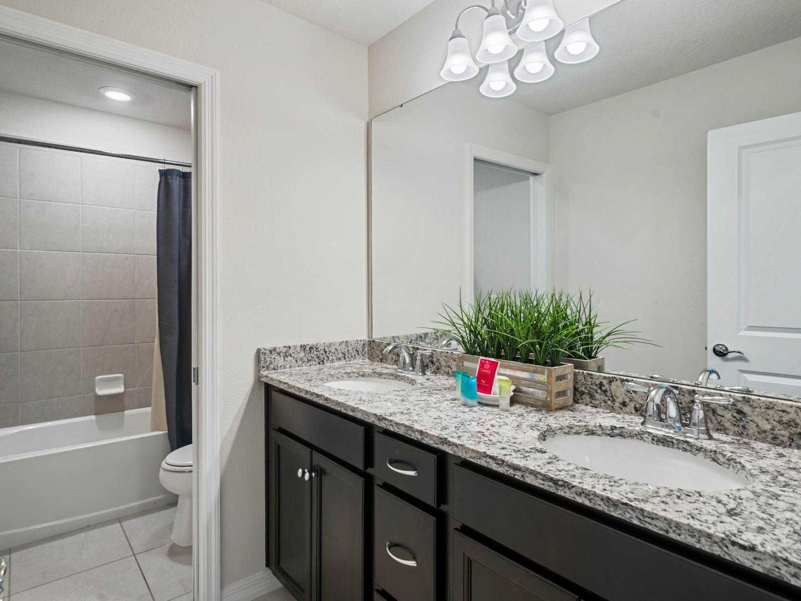 Bathroom 5 with a bathtub and a double sink