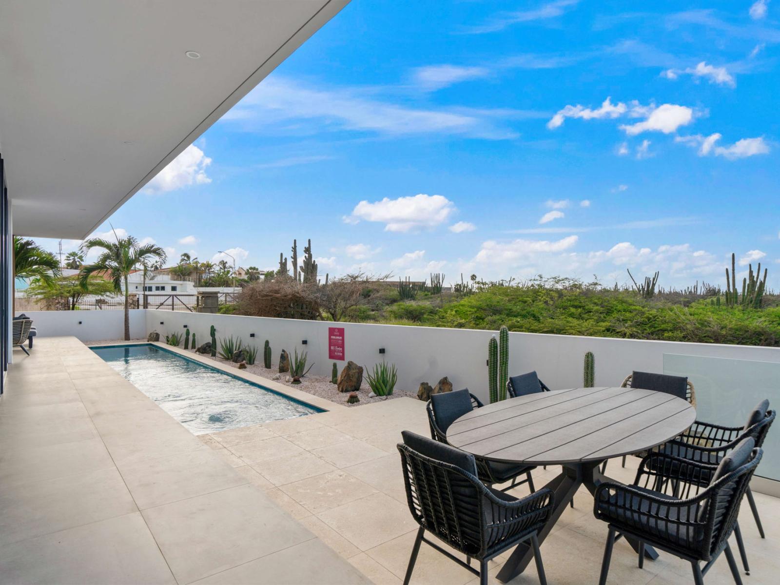 Outside dining table by the pool