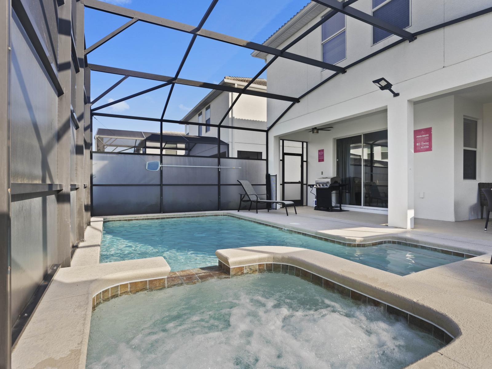 - Spacious outdoor area featuring a private pool and relaxing hot tub - Screened enclosure provides privacy while enjoying the outdoor amenities - Perfect for entertaining, with a BBQ grill and outdoor dining area.