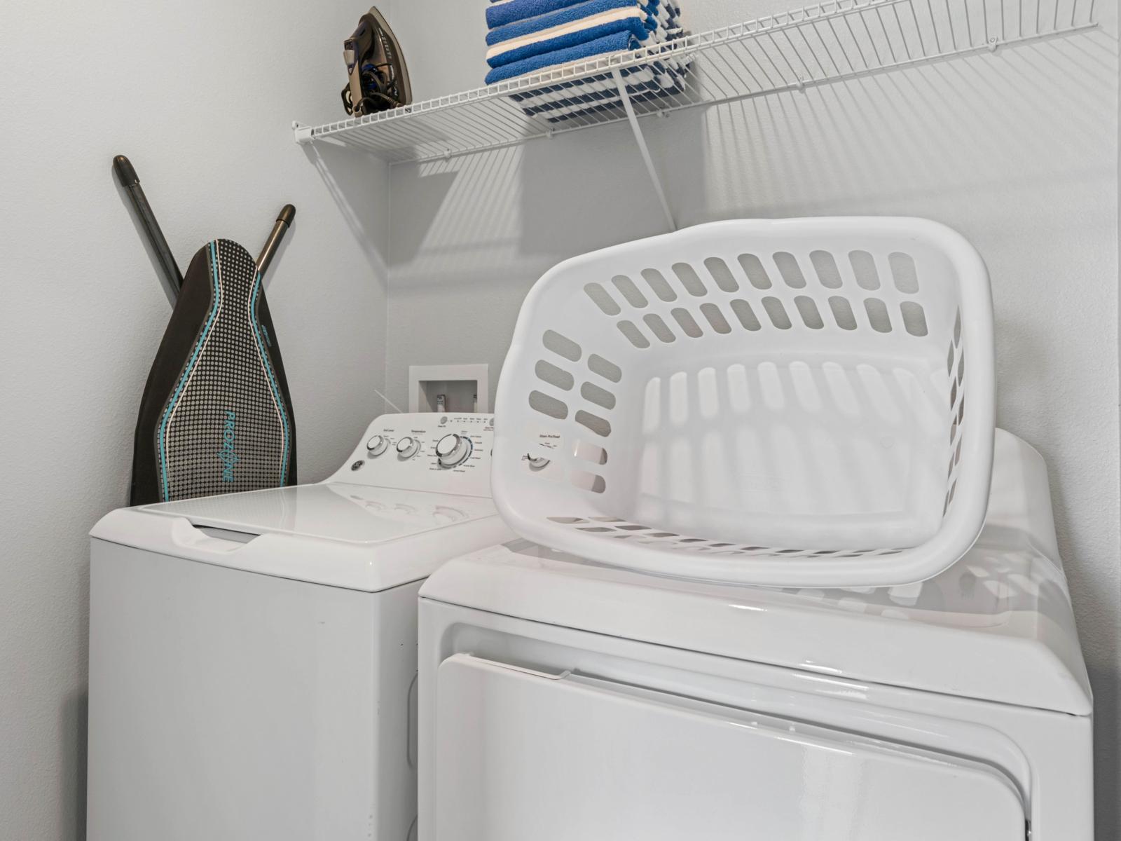 - Convenient in-unit washer and dryer, perfect for hassle-free laundry during your stay - Shelving space with neatly folded towels, offering extra storage for all your laundry essentials - Equipped with an iron and ironing board for quick touch-ups