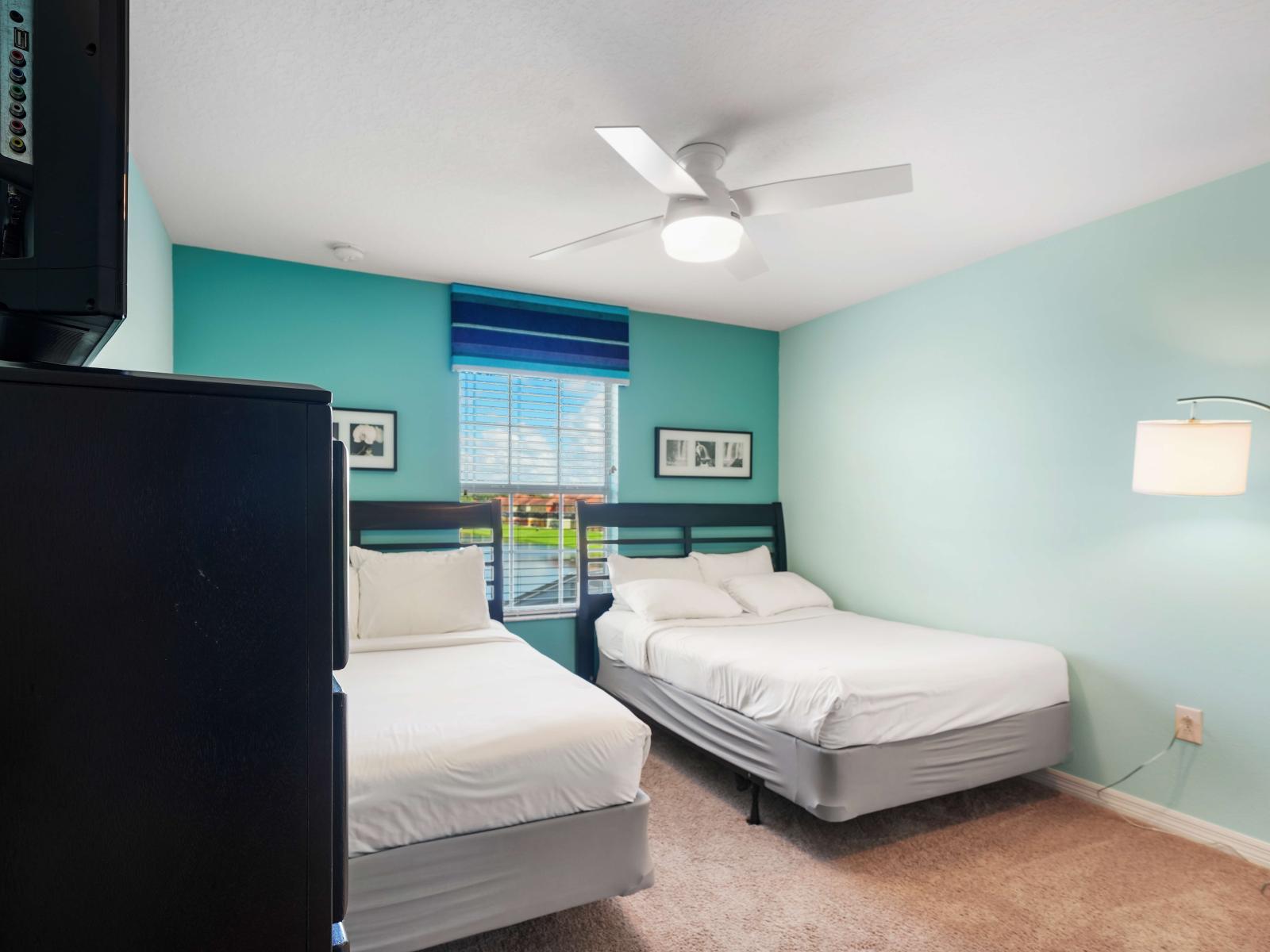 - Serene bedroom featuring both a double bed and a single bed, perfect for flexible sleeping arrangements - Light turquoise walls and striped window treatments add a cheerful touch - Modern lighting enhance the comfortable, relaxing atmosphere