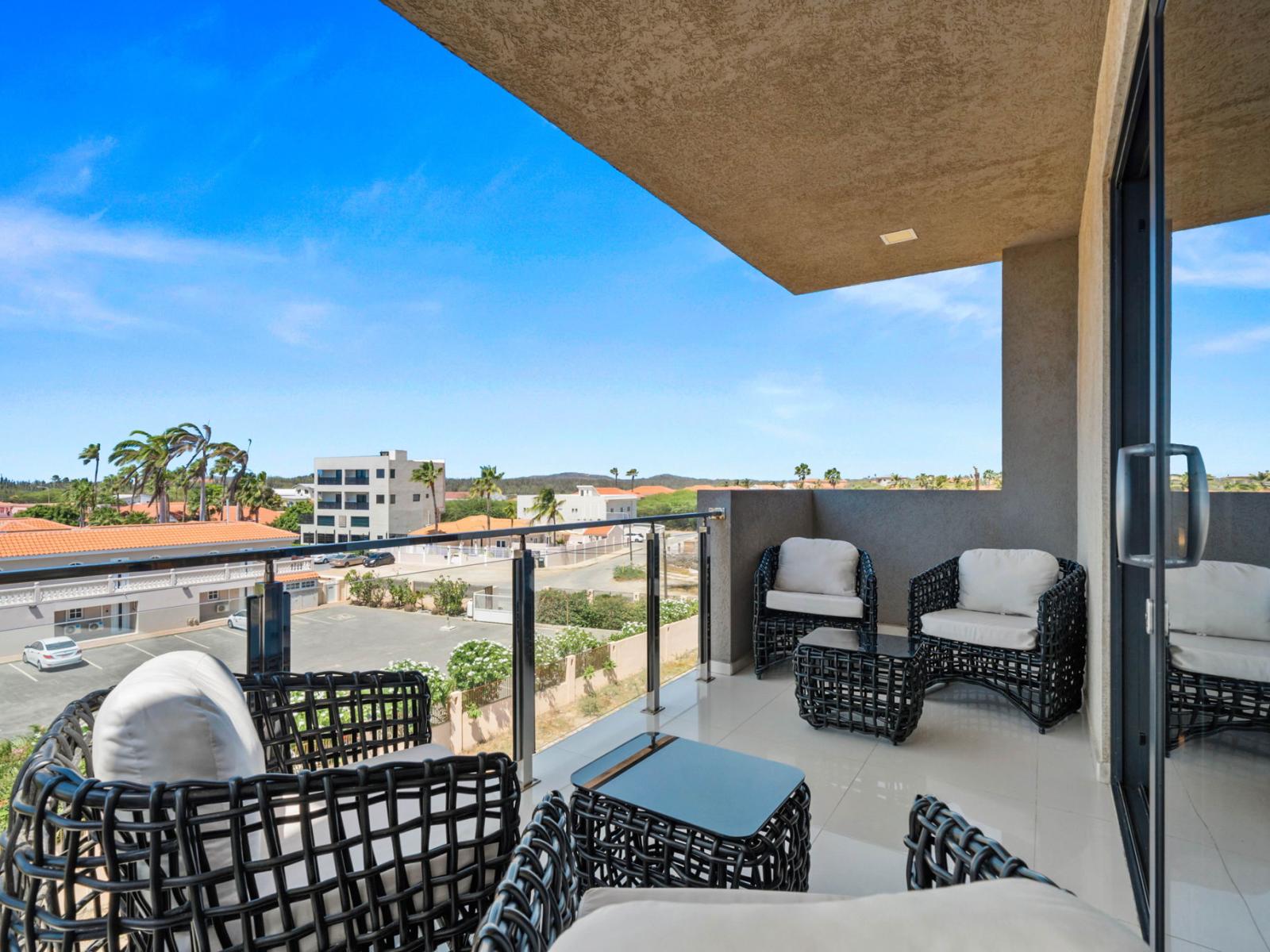 - Elegant balcony with stylish seating, offering beautiful panoramic views - A serene spot to unwind with a book or enjoy quiet conversations - Ideal spot for soaking in the sun or enjoying a tranquil evening breeze