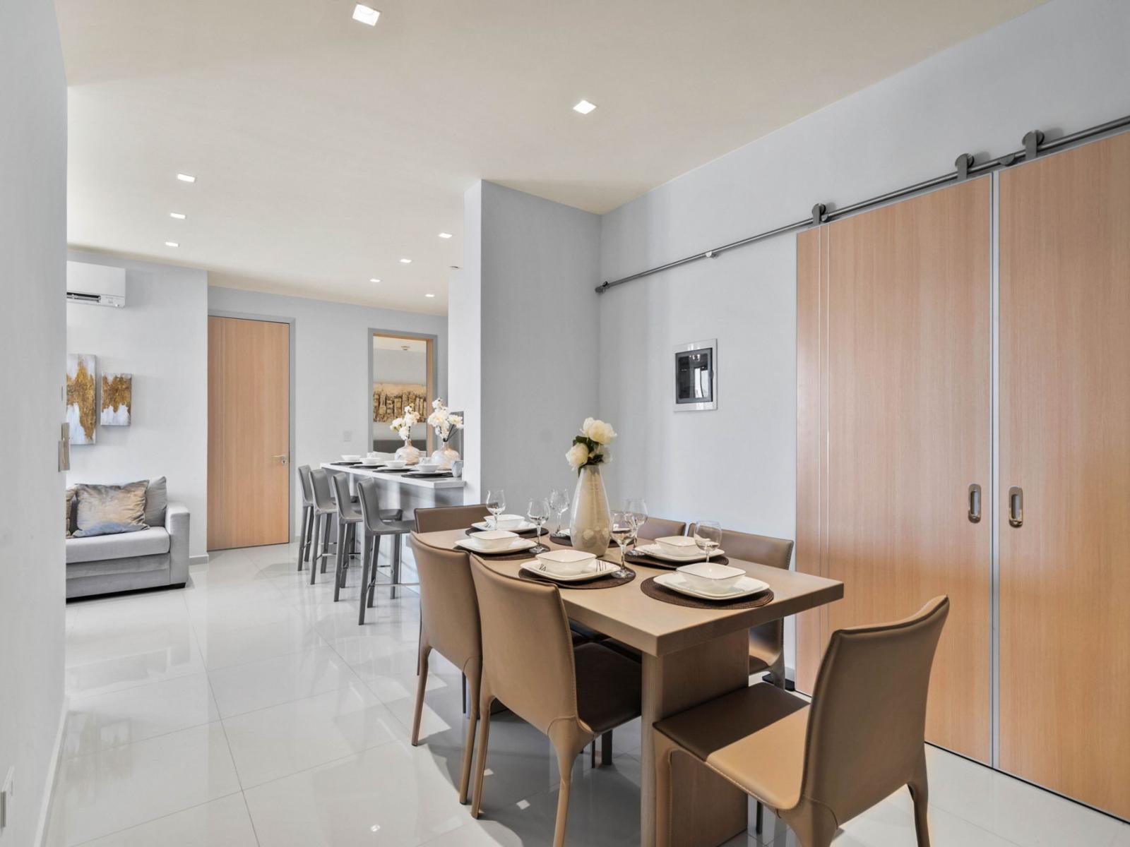 - Spacious dining area with a thoughtful design, perfect for meals and gatherings - Seamlessly connects to the open kitchen and living spaces for easy flow - Comfortable seating for six, creating an inviting atmosphere for dining together