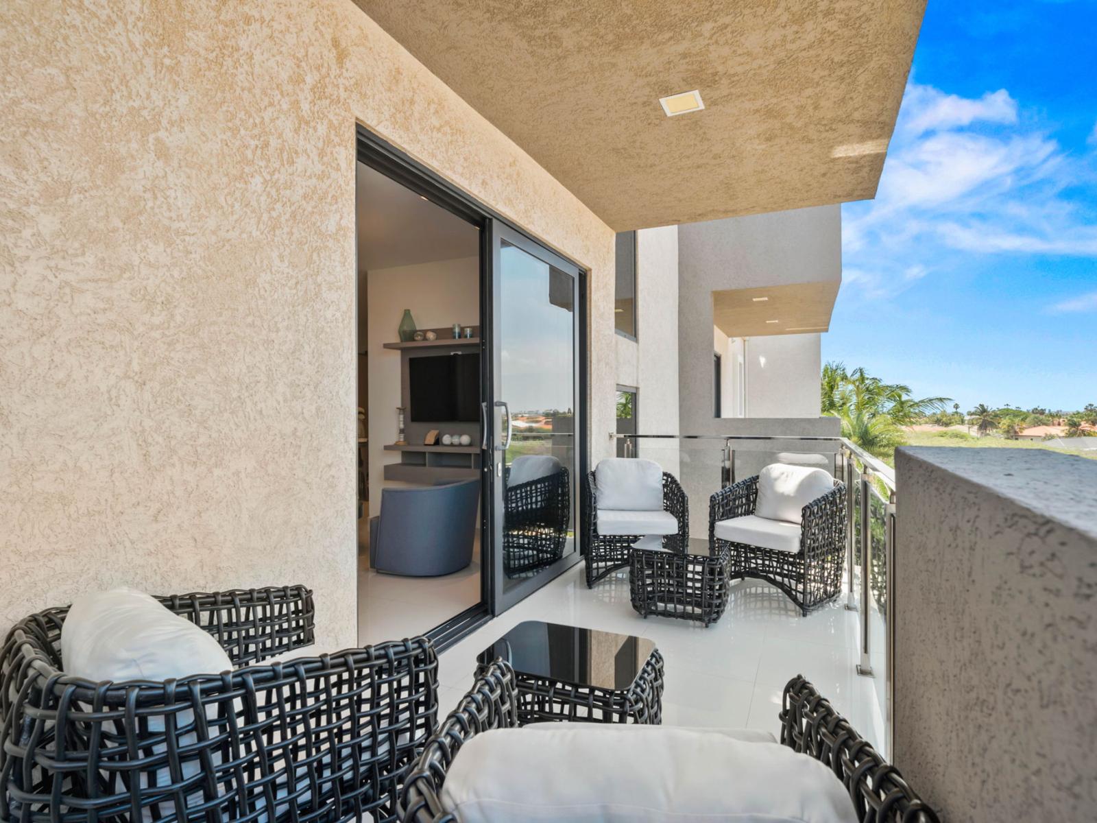 - Spacious balcony with comfortable seating, offering a perfect outdoor retreat - Enjoy the fresh air and views, with direct access to the living area - Idea spot for relaxing with morning coffee or evening conversations