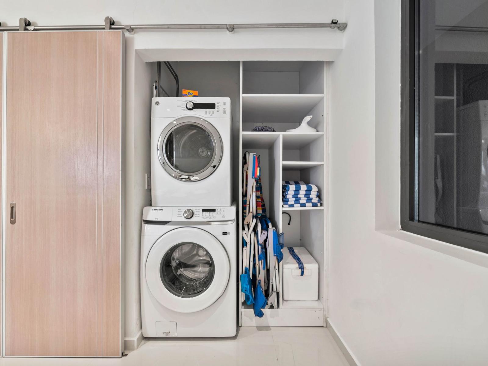 - Convenient in-unit laundry with modern washer and dryer - Organized storage space for cleaning supplies and towels for your stay - Perfect for extended stays, ensuring you have all the comforts of home