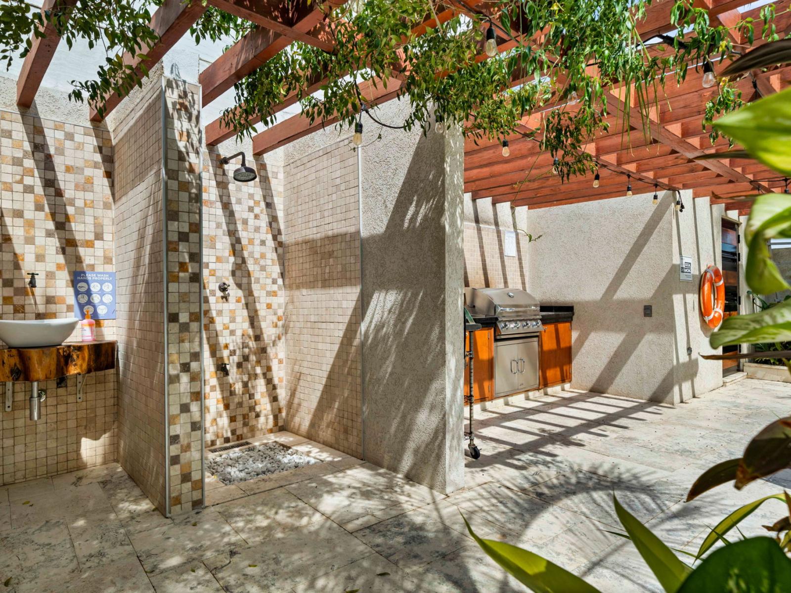 - Outdoor shower and BBQ area, blending nature with modern convenience - Beautifully designed with mosaic tiles and a pergola for shade - Ideal for rinsing off after a swim or preparing a delicious outdoor meal