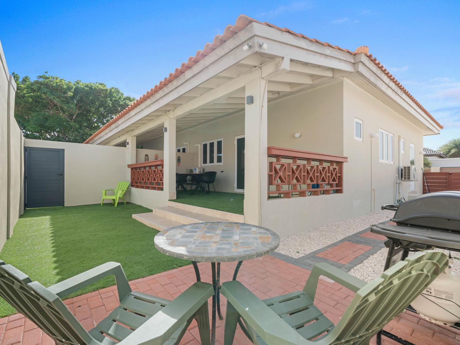 - Spacious backyard with a covered patio and a private BBQ area for your enjoyment - Ideal for hosting barbecues, relaxing under the shaded seating, or soaking up the sun - beautiful greenery and thoughtful design create a welcoming outdoor retreat