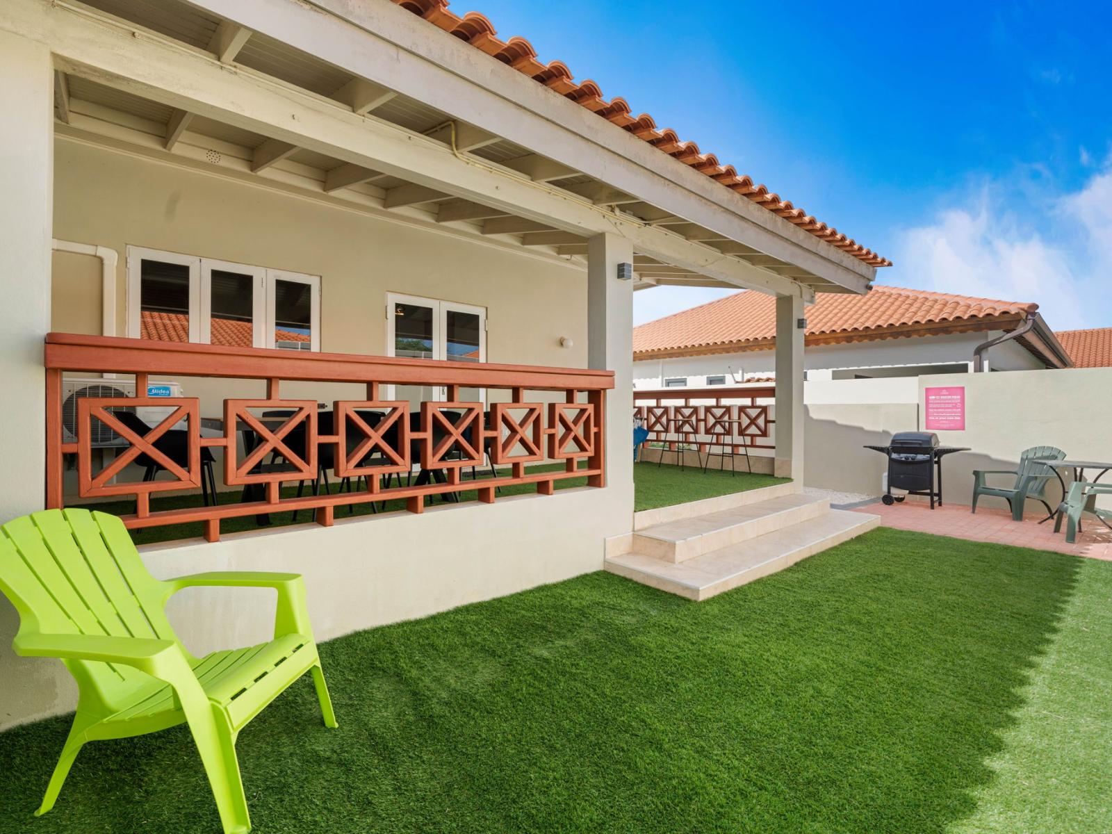 - Private backyard oasis with vibrant greenery and a cozy covered patio. - Fire up the BBQ grill for a fun cookout or lounge with a drink under the shaded seating. - Welcoming space to relax, unwind, and soak up the tropical vibes.