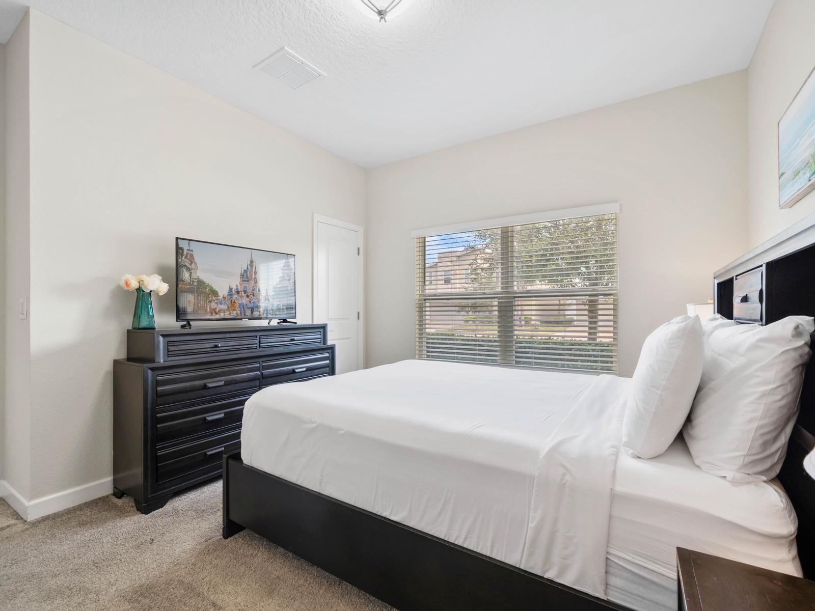 Your Private Retreat: Unwind in this tranquil bedroom featuring natural light, stylish furnishings, and a peaceful atmosphere.