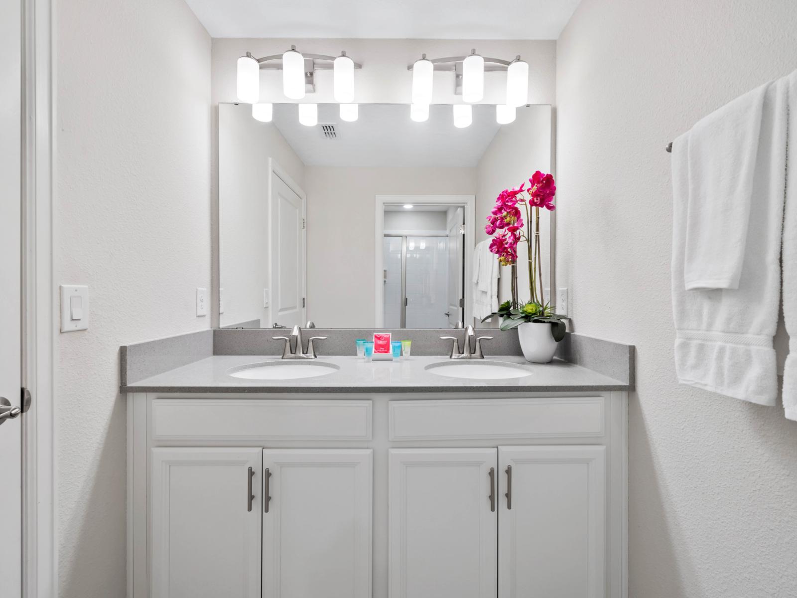 Sleek & Stylish: Enjoy a contemporary bathroom featuring a spacious walk-in shower, perfect for unwinding after a long day.