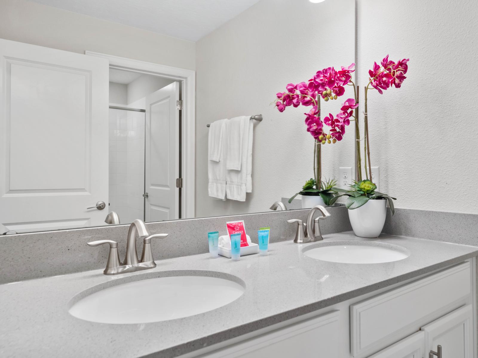 Sleek & Stylish: Enjoy a contemporary bathroom featuring a spacious walk-in shower, perfect for unwinding after a long day.