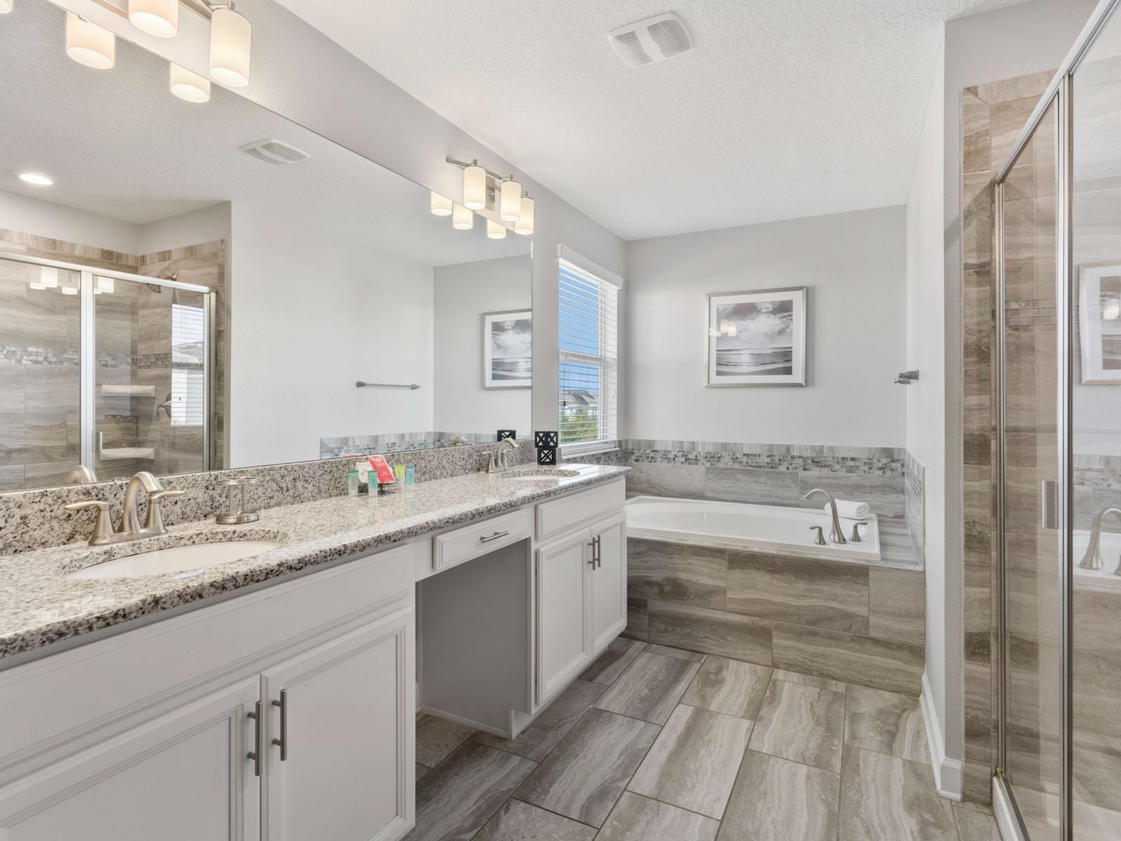 Main Bathroom:  Experience the sleek main bathroom with a spacious walk-in shower, modern fixtures, and all essentials for a refreshing start to your day.