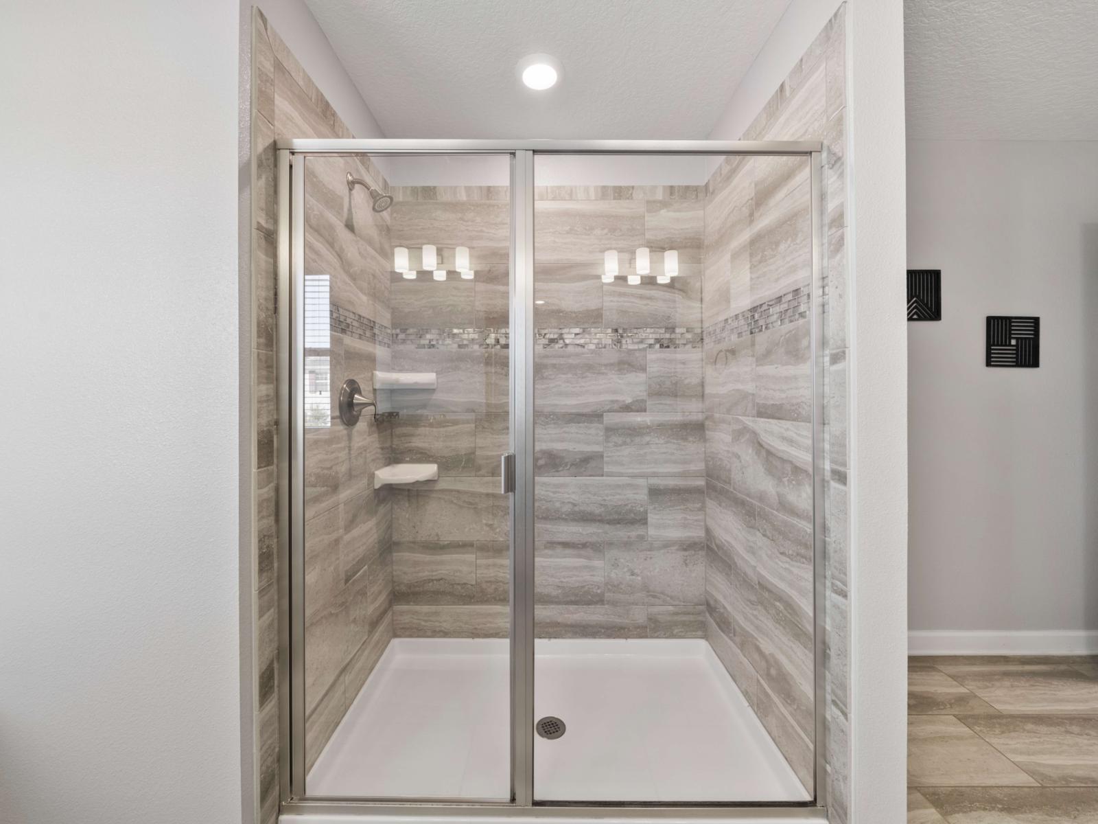 Main Bathroom:  Experience the sleek main bathroom with a spacious walk-in shower, modern fixtures, and all essentials for a refreshing start to your day.