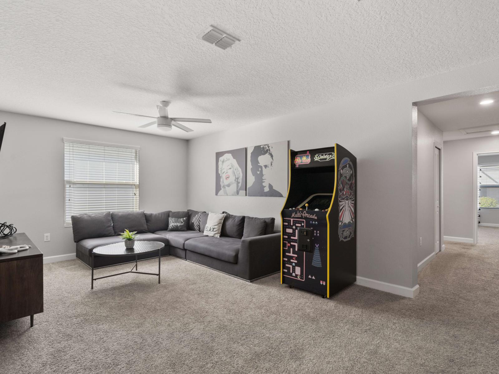 Loft Living Area (Arcade Feature):  Step up to the loft living area, featuring a retro arcade machine for endless fun—perfect for entertaining guests of all ages!