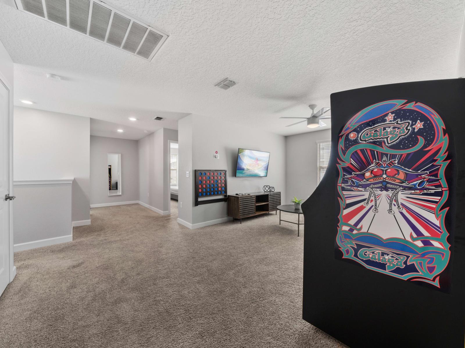 Loft Living Area (Arcade Feature):  Step up to the loft living area, featuring a retro arcade machine for endless fun—perfect for entertaining guests of all ages!