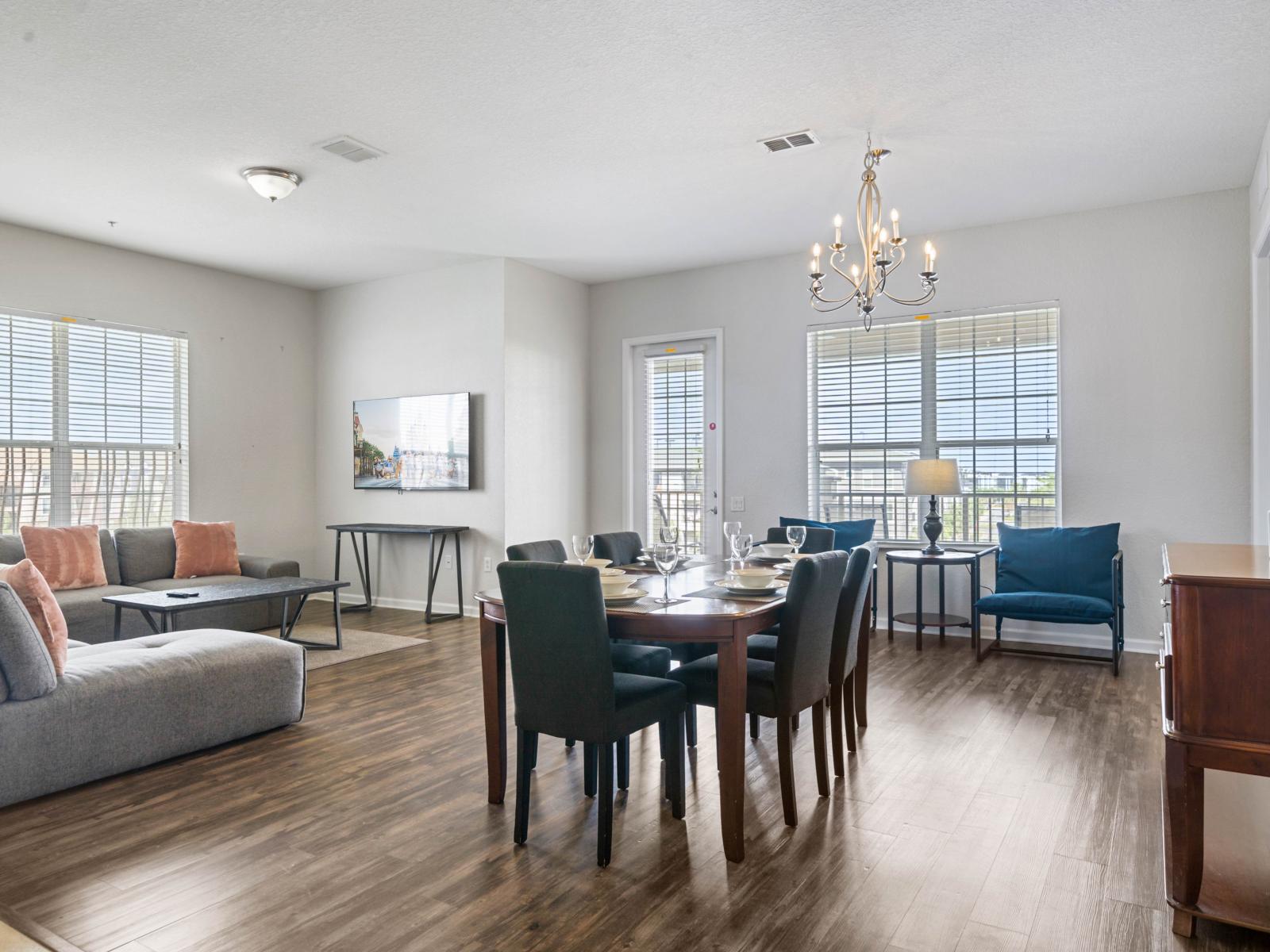 - Spacious, open-concept living & dining area designed for relaxation - Large windows fill the room with natural light, complemented by tasteful decor & cozy seating - Perfect for hosting dinners, watching movies, or creating cherished memories