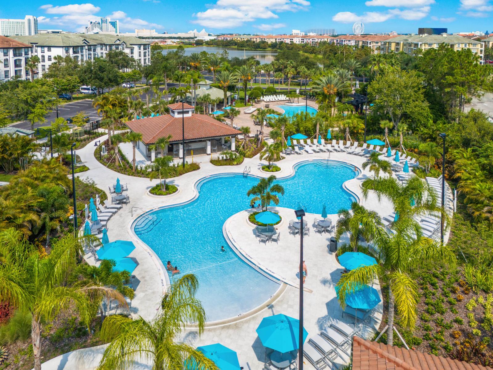 - Resort-style crystal-clear pool surrounded by tropical landscaping - Relax under umbrellas, take a refreshing swim, or soak up the sun in this serene paradise - Dreamy outdoor space, ideal for fun-filled days or peaceful evenings by the water