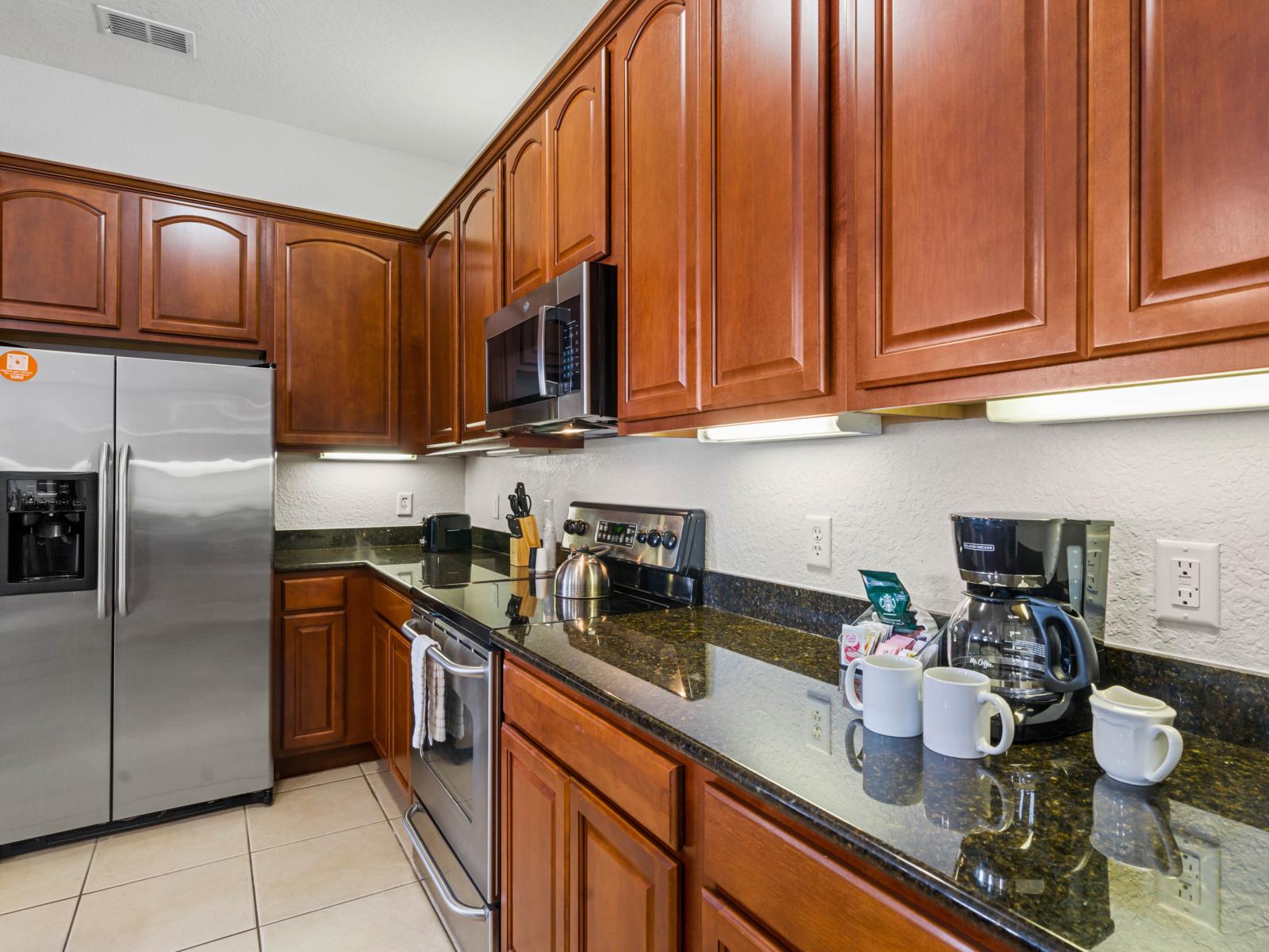 - Fully equipped kitchen with granite countertops, stainless steel appliances, &  rich wooden cabinetry - Preparing meals with ease, whether it’s a quick breakfast or a gourmet dinner - Essential utensils are included, ensuring convenience & comfort