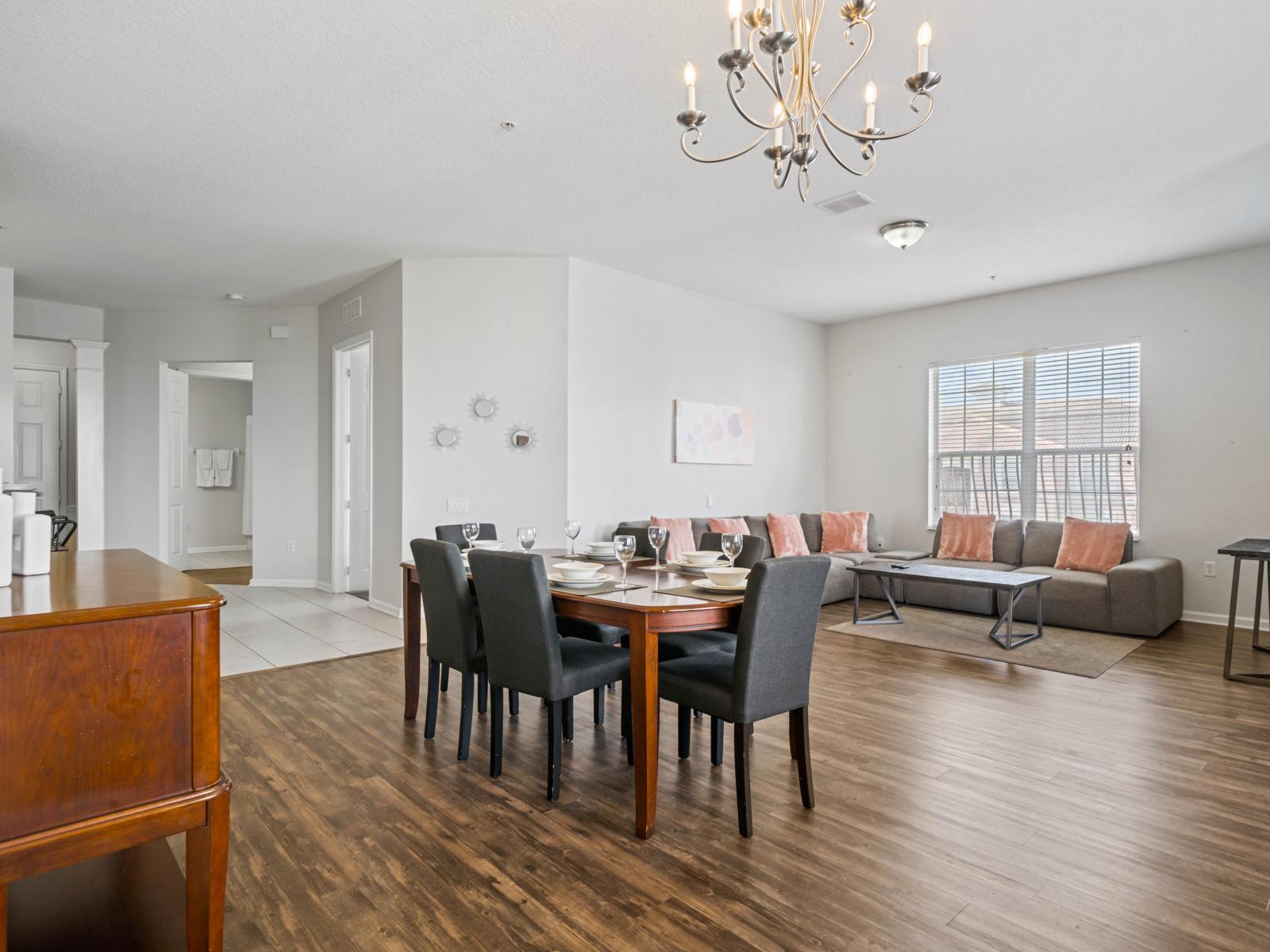 - Spacious open-concept dining and living area with modern and elegant decor - Features a large dining table for family meals and a cozy seating area to relax or entertain - Flooded with natural light, this is the heart of your home away from home