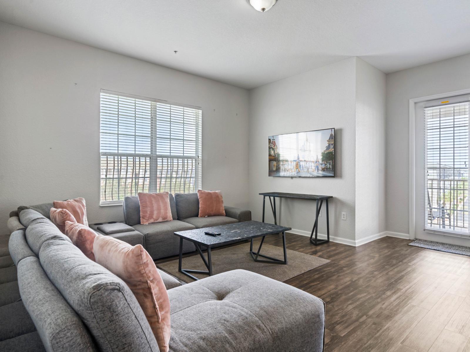 - Cozy living room with direct access to the balcony for a refreshing indoor-outdoor vibe - Stylish decor, soft pillows, & smart TV make this area ideal for relaxation - Open and airy, with hardwood floors & plenty of space to stretch out after a day