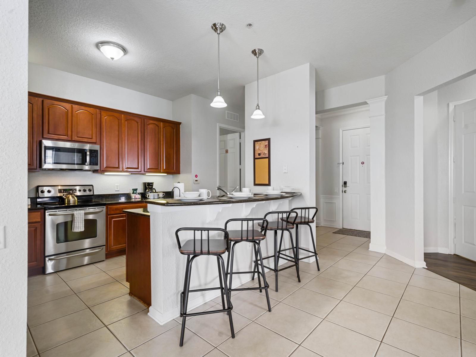 - Fully equipped kitchen with stainless steel appliances & stylish wooden cabinetry - Convenient breakfast bar with seating for three, perfect for casual meals or morning coffee - Bright & airy, with modern pendant lighting to enhance the ambiance