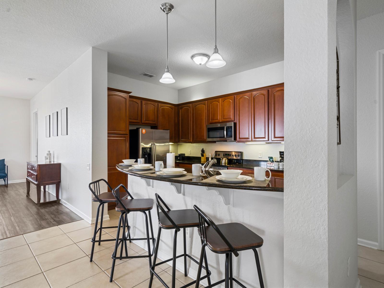 - Contemporary kitchen design with a focus on functionality and aesthetics - Breakfast bar setup creates a seamless flow into the living and dining areas - Welcoming space to gather, cook, and enjoy quality time together