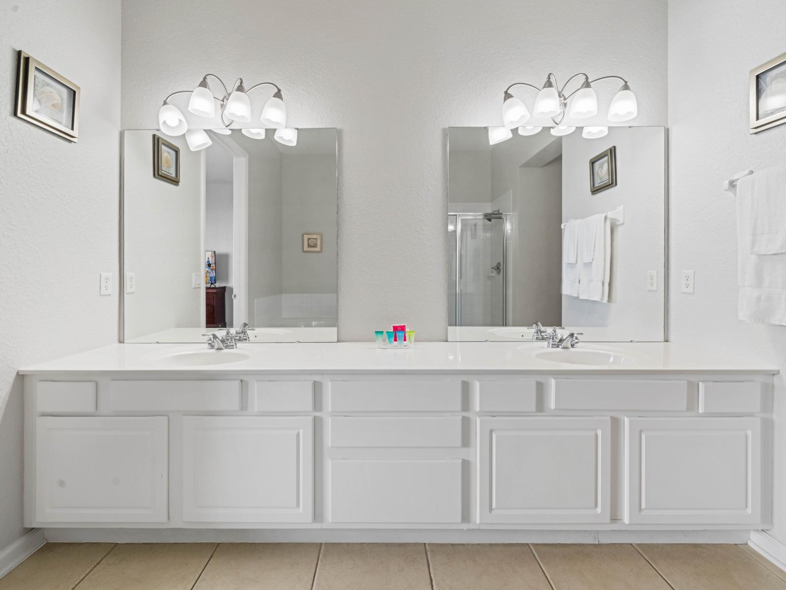 - Bright &  modern bathroom with a large double vanity, perfect for couples or families - Illuminated mirrors & plenty of counter space provide convenience &  a touch of brilliance - Stocked with fresh towels & toiletries to ensure a comfortable stay