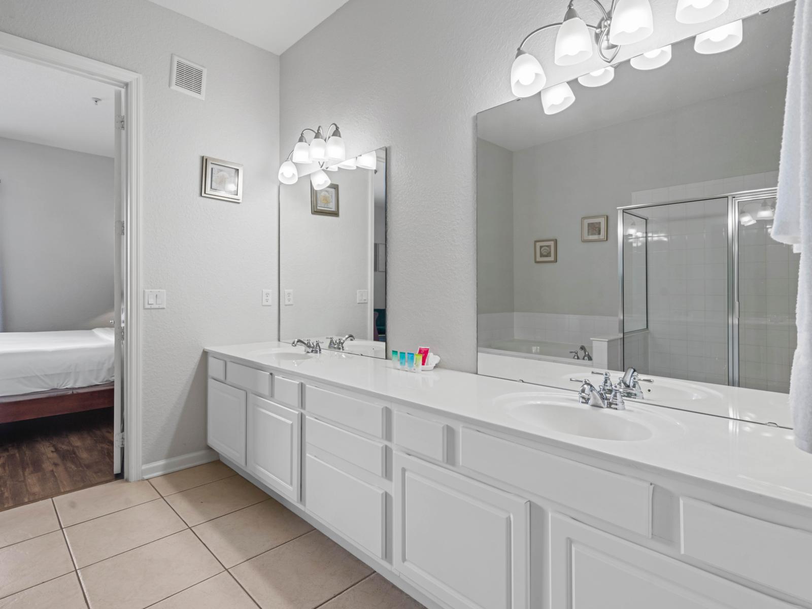 - Bathroom with a sleek double vanity & elegant lighting for a polished look - Spacious & functional, with plenty of room for getting ready in the morning or unwinding at night - Stylish & clean space, connected conveniently to the master bedroom