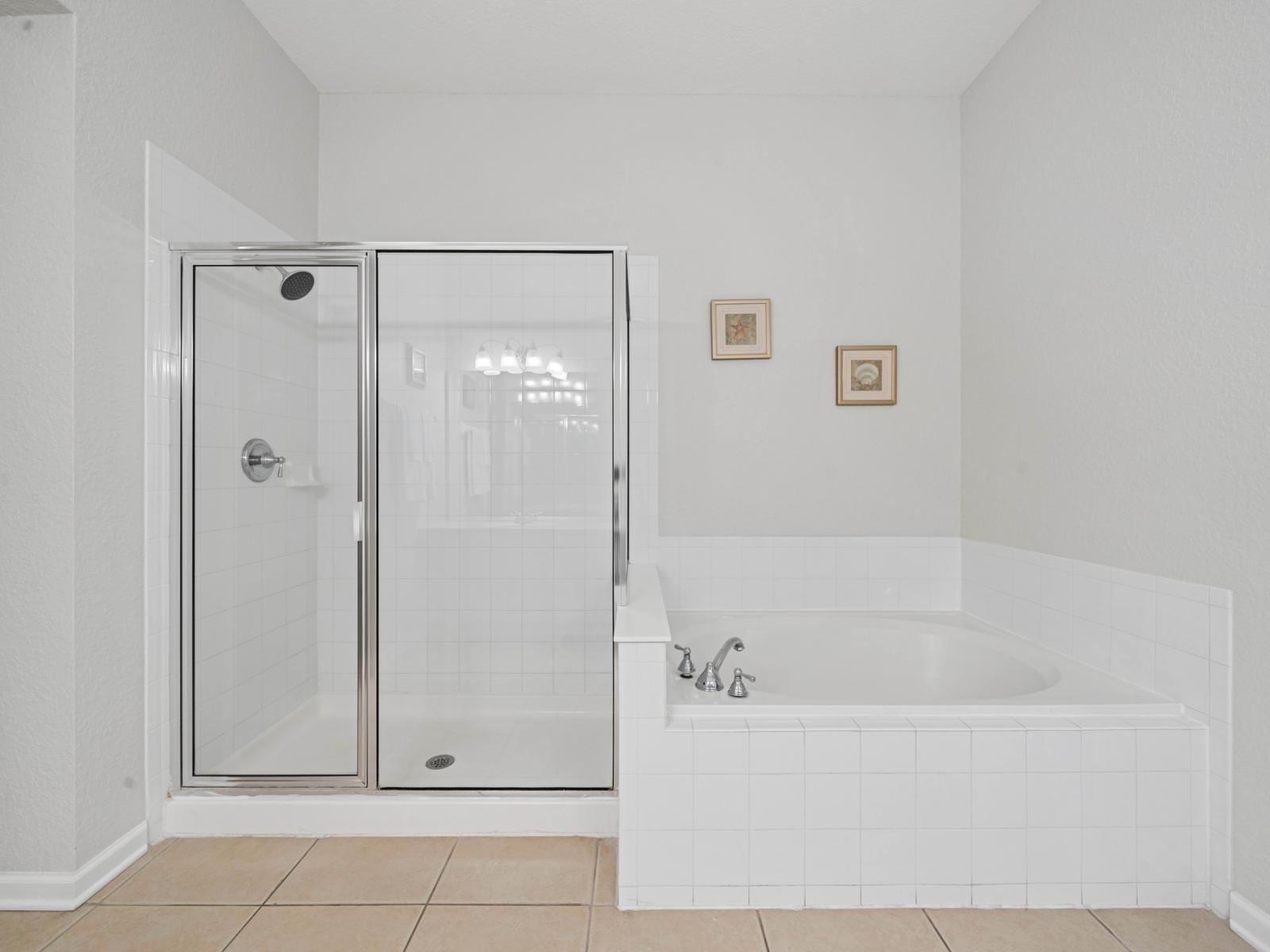 - Step into a pristine, modern bathroom with sleek finishes and a spacious layout - Whether you’re preparing for a day out or winding down, this space has it all - Clean, stylish, and perfect for creating memorable moments during your stay