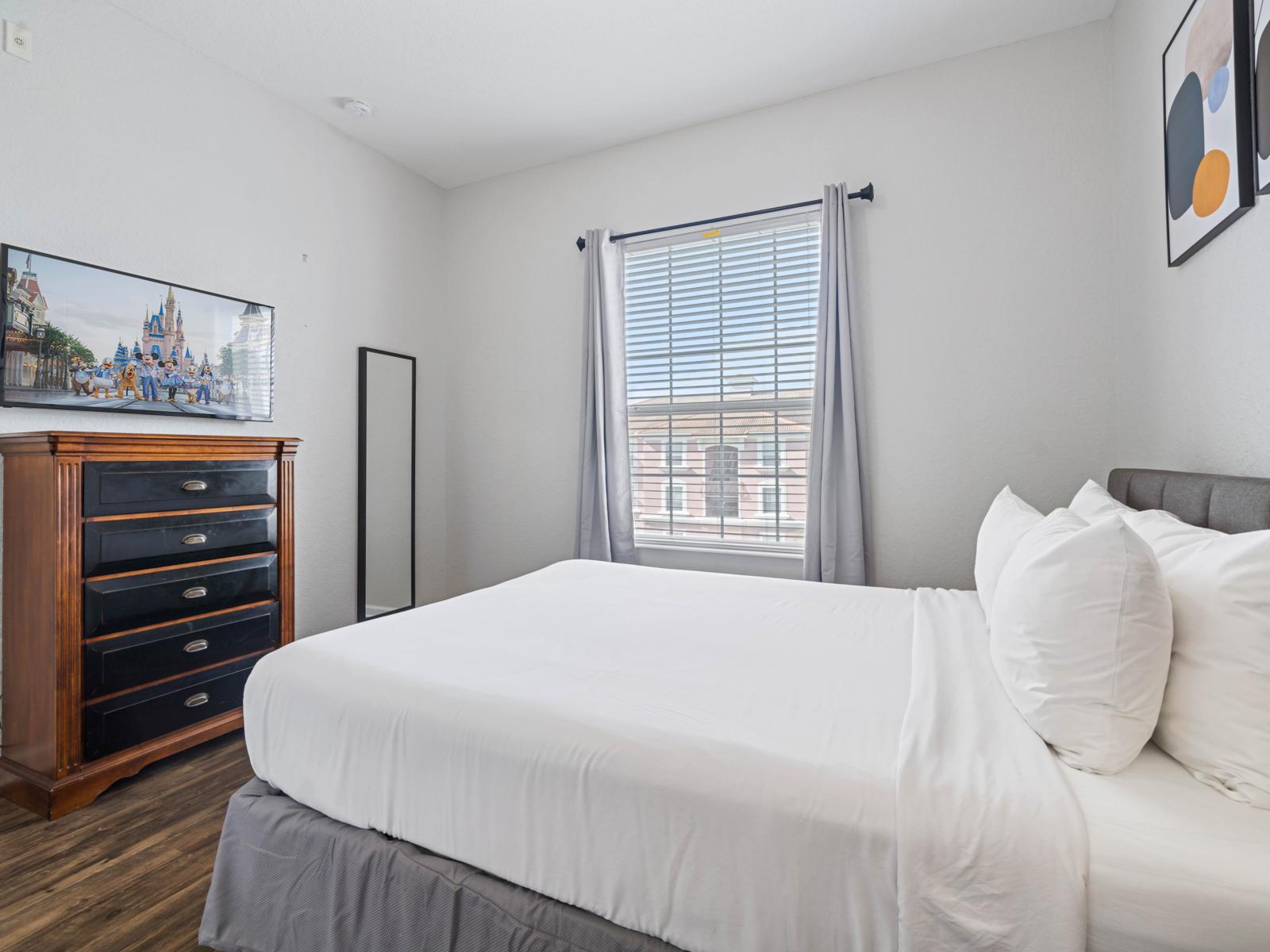 - Rest easy on a plush queen bed with beautiful linens and cozy pillows - Enjoy your favorite shows on a smart TV and stylish decor for a relaxing vibe - Large windows offer natural light, creating a warm and welcoming retreat