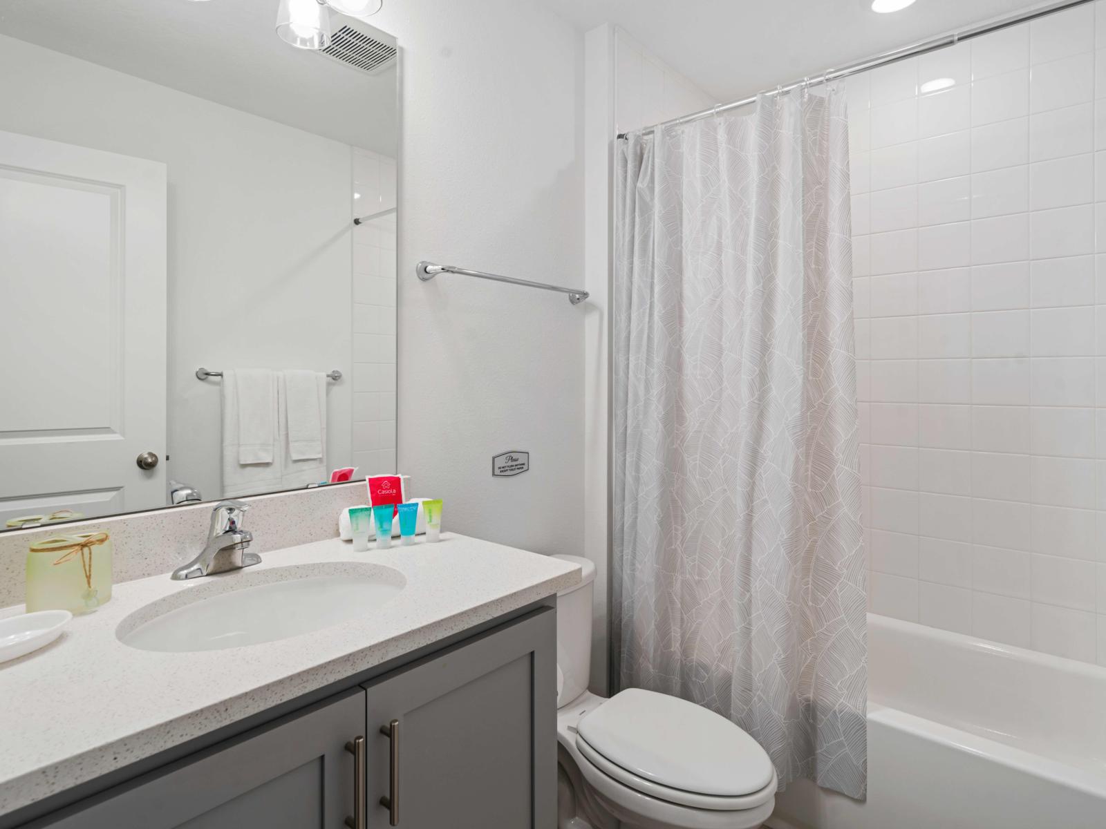 Bathroom 2 with a bathtub and shower combination